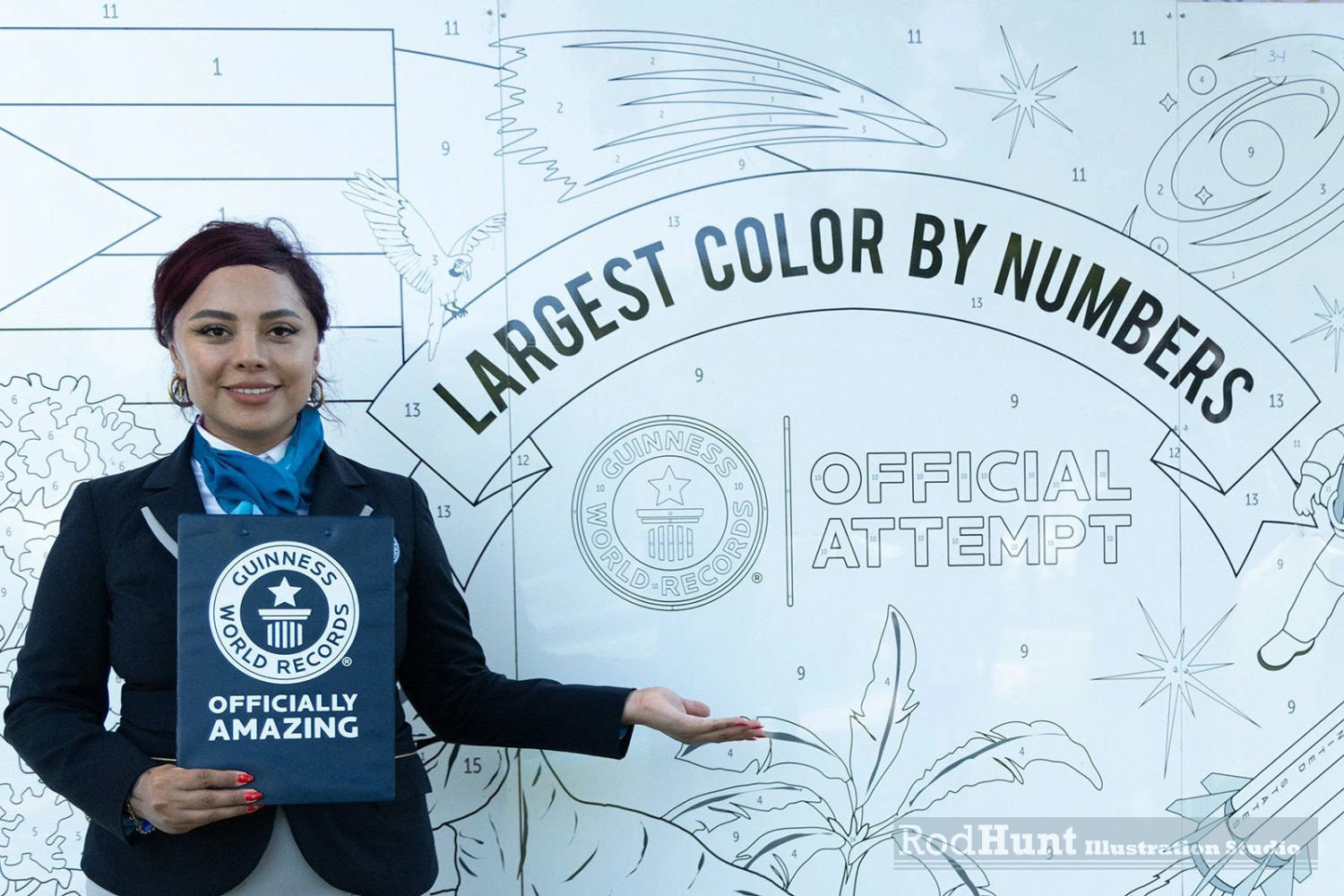 Rod Hunt worked with Guinness World Records in 2024 to illustrate the Worlds Largest Colour By Numbers! Based on his Guinness Word Records book covers from 2021 - 2024. He had to translate his colour illustrations to black & white line then create a continuous site-specific artwork measuring 200 m² (2152.78 ft²)! Then Rod created a colour key for the numbers for each pen colour to be added. Needless to say it was a bit of a challenge. School children were invited to Parque de las Ciencias (Puerto Rico) at Bayamón Parque de las Ciencias to colour the artwork for the Guinness World Record attempt.  WHO: PARQUE DE LAS CIENCIAS - WHAT: 200 SQUARE METRE(S) - WHERE: PUERTO RICO (BAYAMÓN) - WHEN: 18 SEPTEMBER 2024  The largest colour by numbers template is 200 m² (2152.78 ft²) and was achieved by Parque de las Ciencias (Puerto Rico) at Bayamón Parque de las Ciencias, Puerto Rico, on 18 September 2024. Parque de las Ciencias achieved this record with a colour by numbers template themed around the original Guinness World Records book cover artwork illustrated by Rod Hunt (UK).