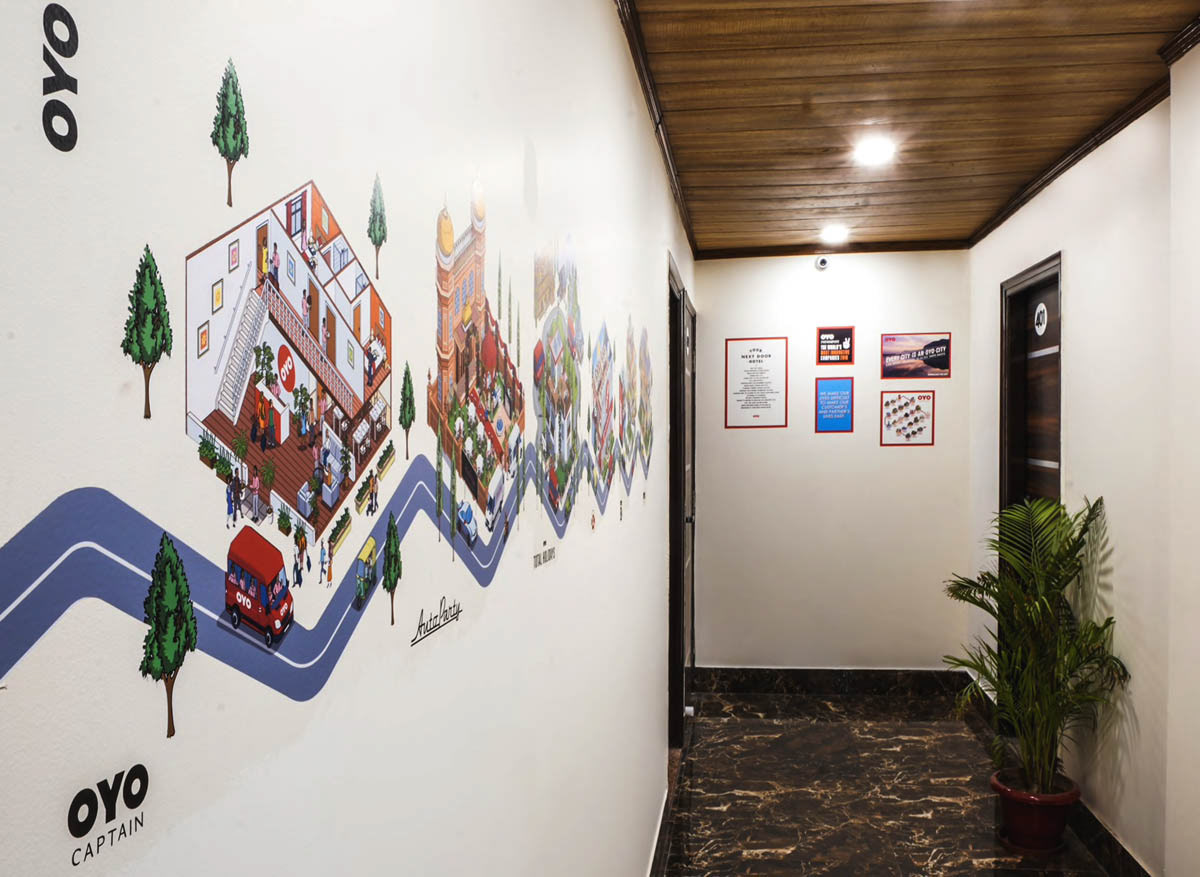 Mural art in OYO Hotel lobby - large printed vinyl mural illustration