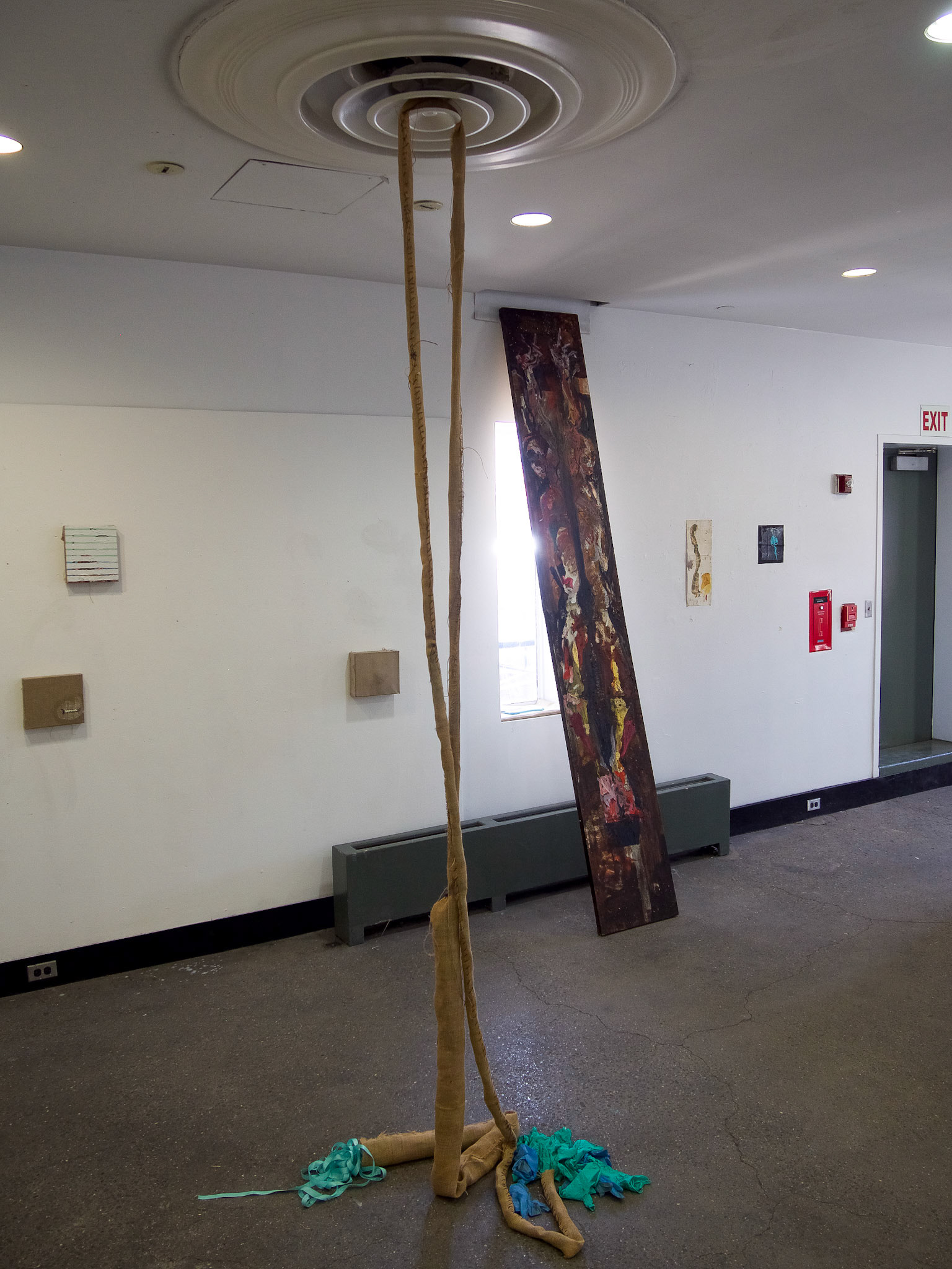 Flax Burlap, 2021 - spring 2022s’ used rubber gloves and Tiffany ble ribon.  27’  long a life size digestive tract.