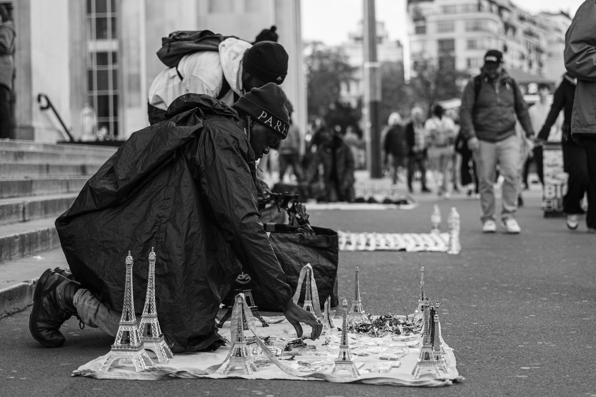 Men selling souvenir in Trocadero, Paris