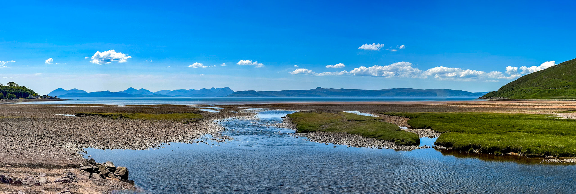 View from the River Applecross looking across Applecross Bay towards Raasay with Skye in the background