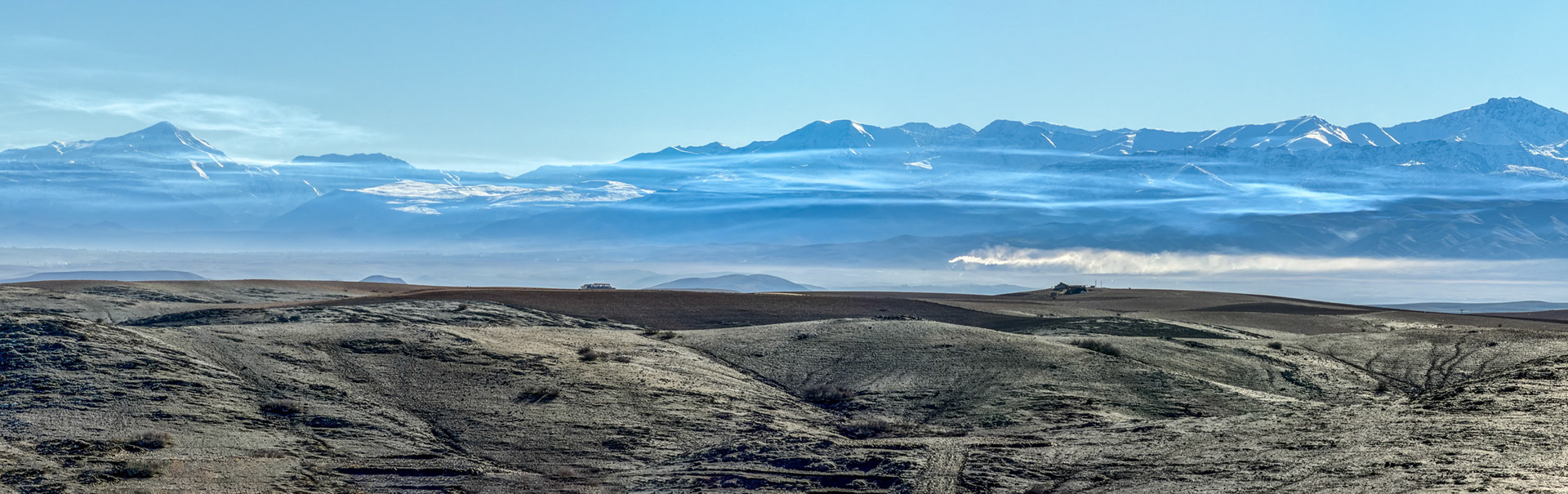 Wispy clounds across the Atlas Mountains, from the Agafay Desert, Morocco