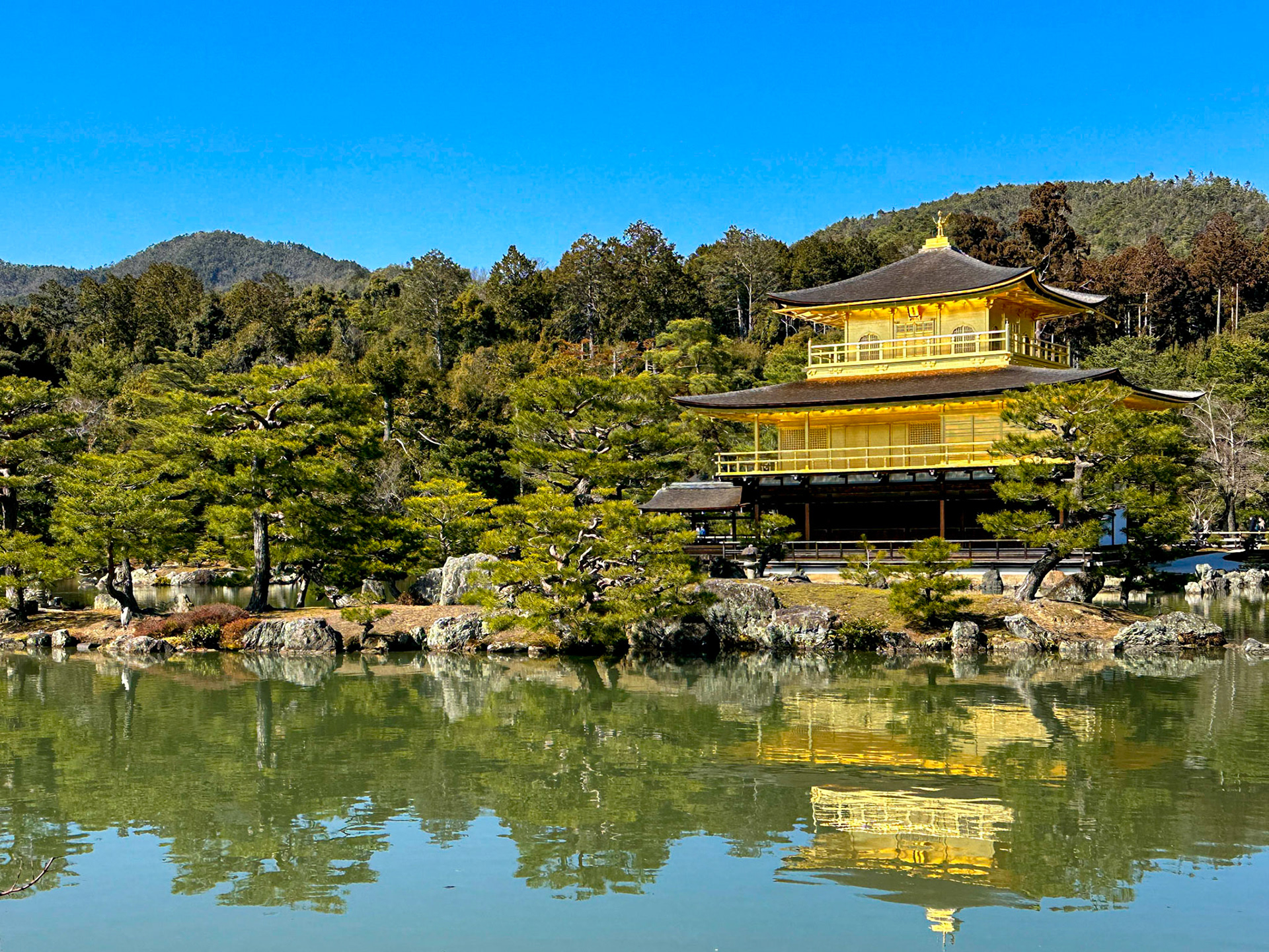 Kinkaku-ji temple reflected in lake, Kyoto, Japan