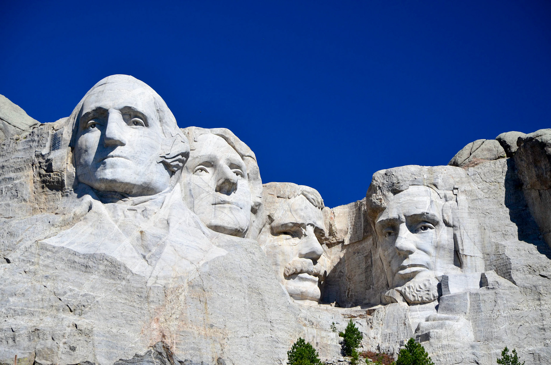 Mount Rushmore South Dakota against a deep blue sky