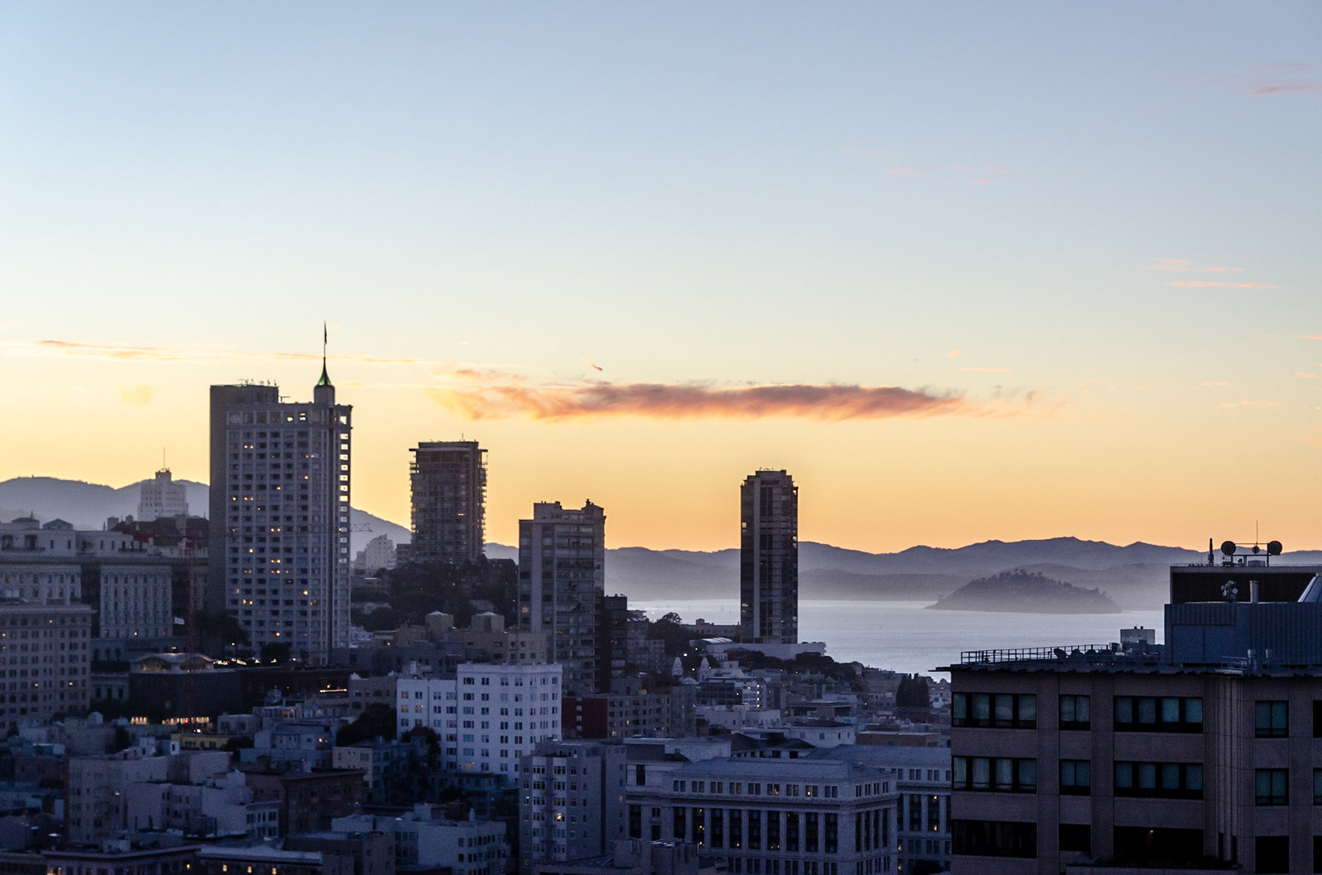 San Francisco at sunset with mist on the bay