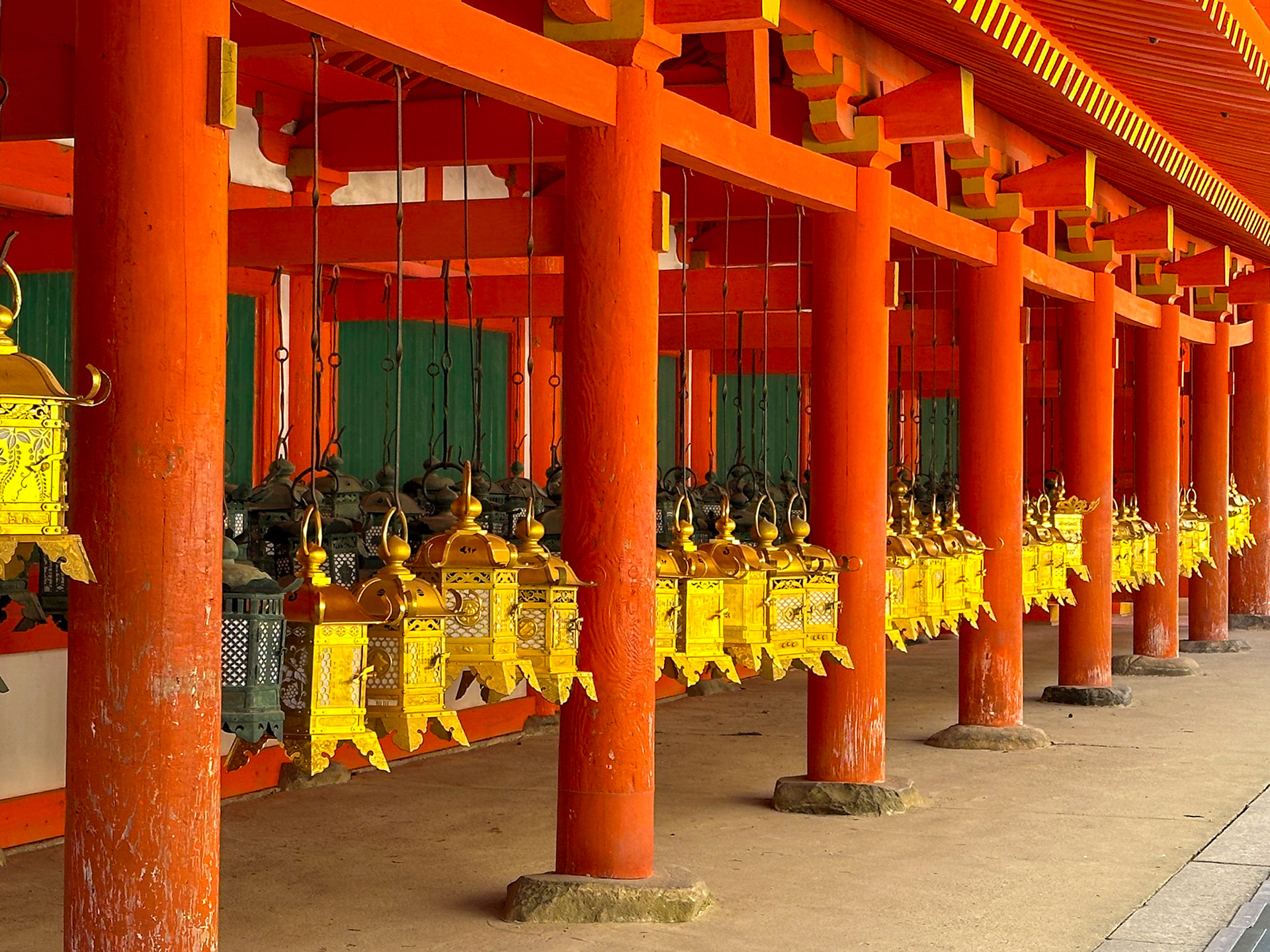 Hanging lanterns in gold and black at Kasuga-taisha shrine in Nara, Japan