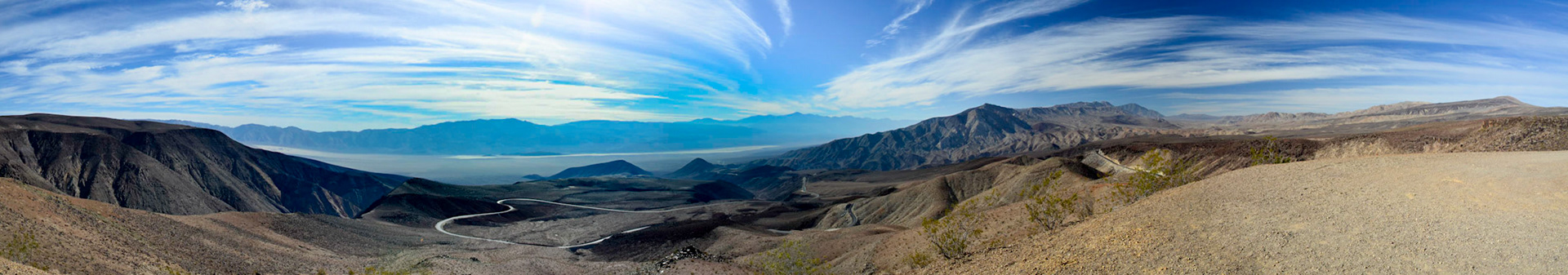 Panorama including the winding road leading into Death Valley