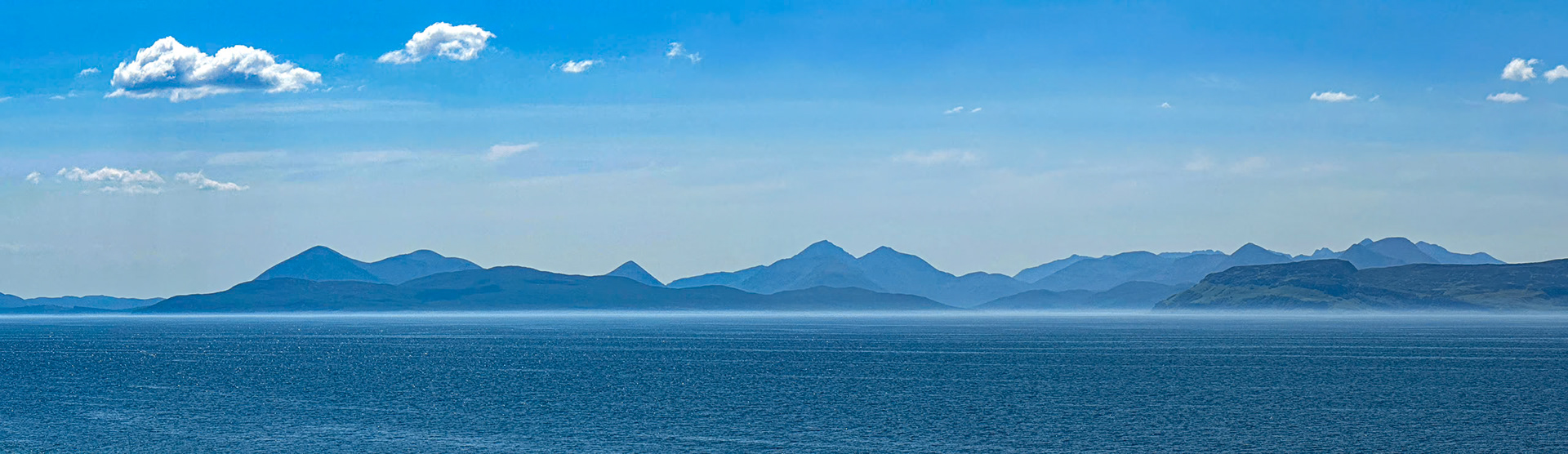 View looking across Applecross Bay towards Raasay with Skye in the background