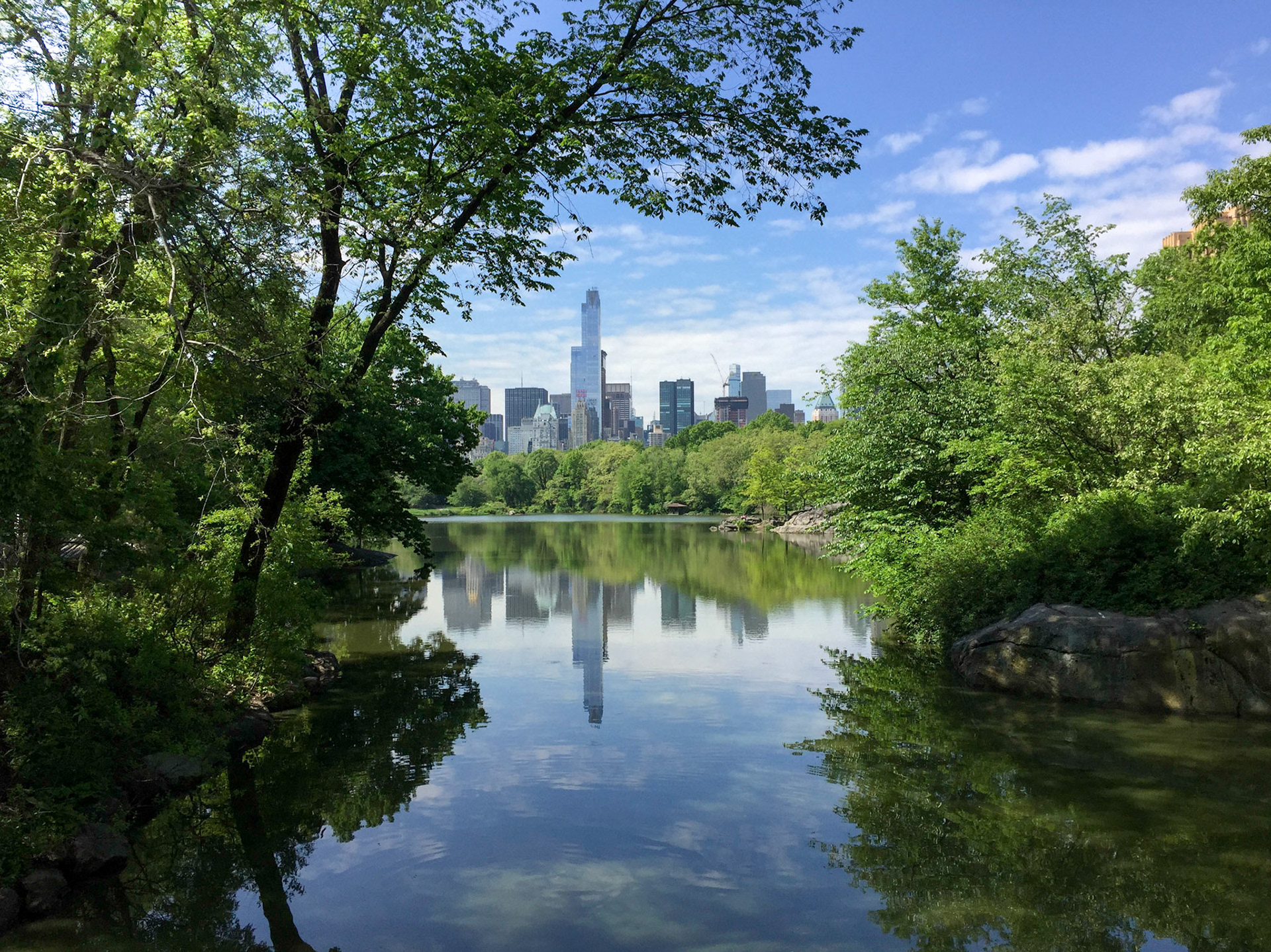 View of Central Park South reflected in Central Park Lake, New York