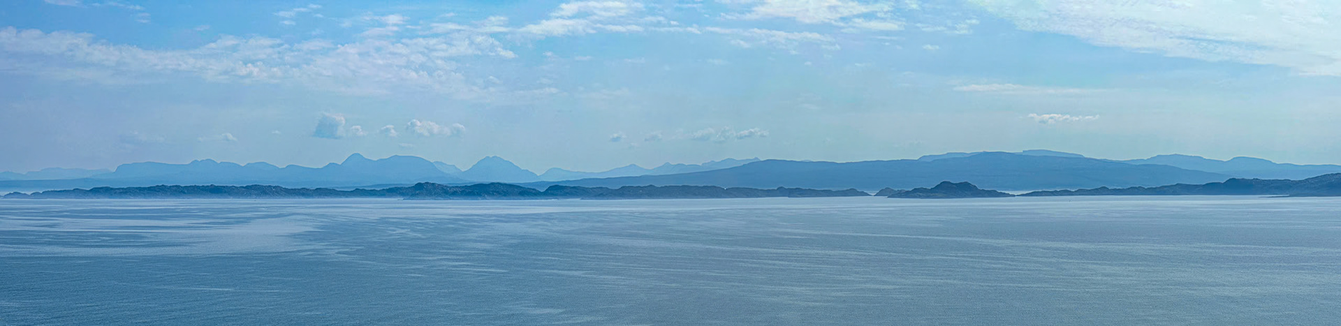 Looking east from Rigg, Isle of Skye towards Rona and Raasay with the mountains in the background