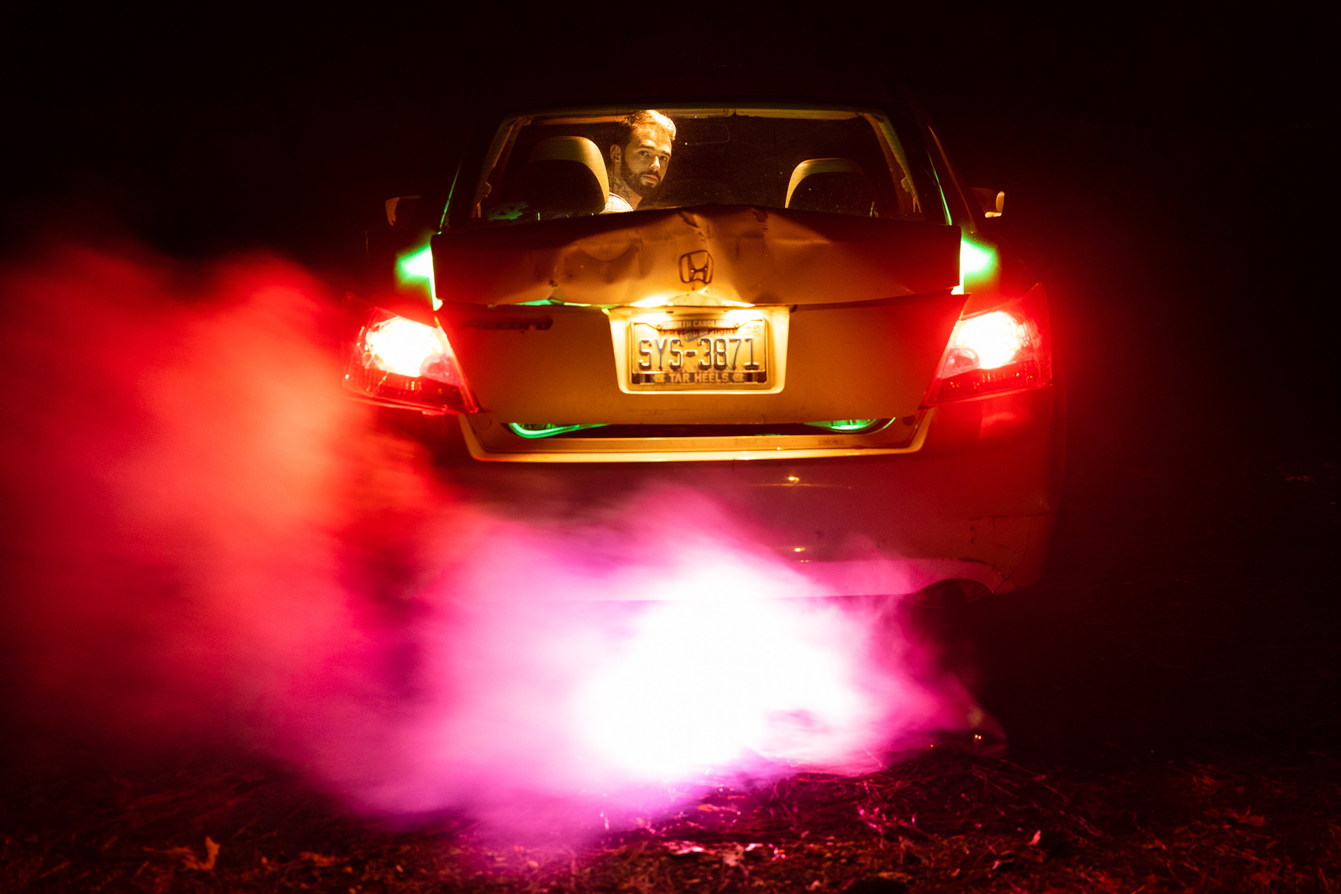 Abe Loven poses for a self-portrait in his car in Chapel Hill, N.C., Sept. 28, 2020. Three days prior, he was rear-ended while driving on the interstate. “I was surprised by how bad the damage to my car was,” he said after the accident.