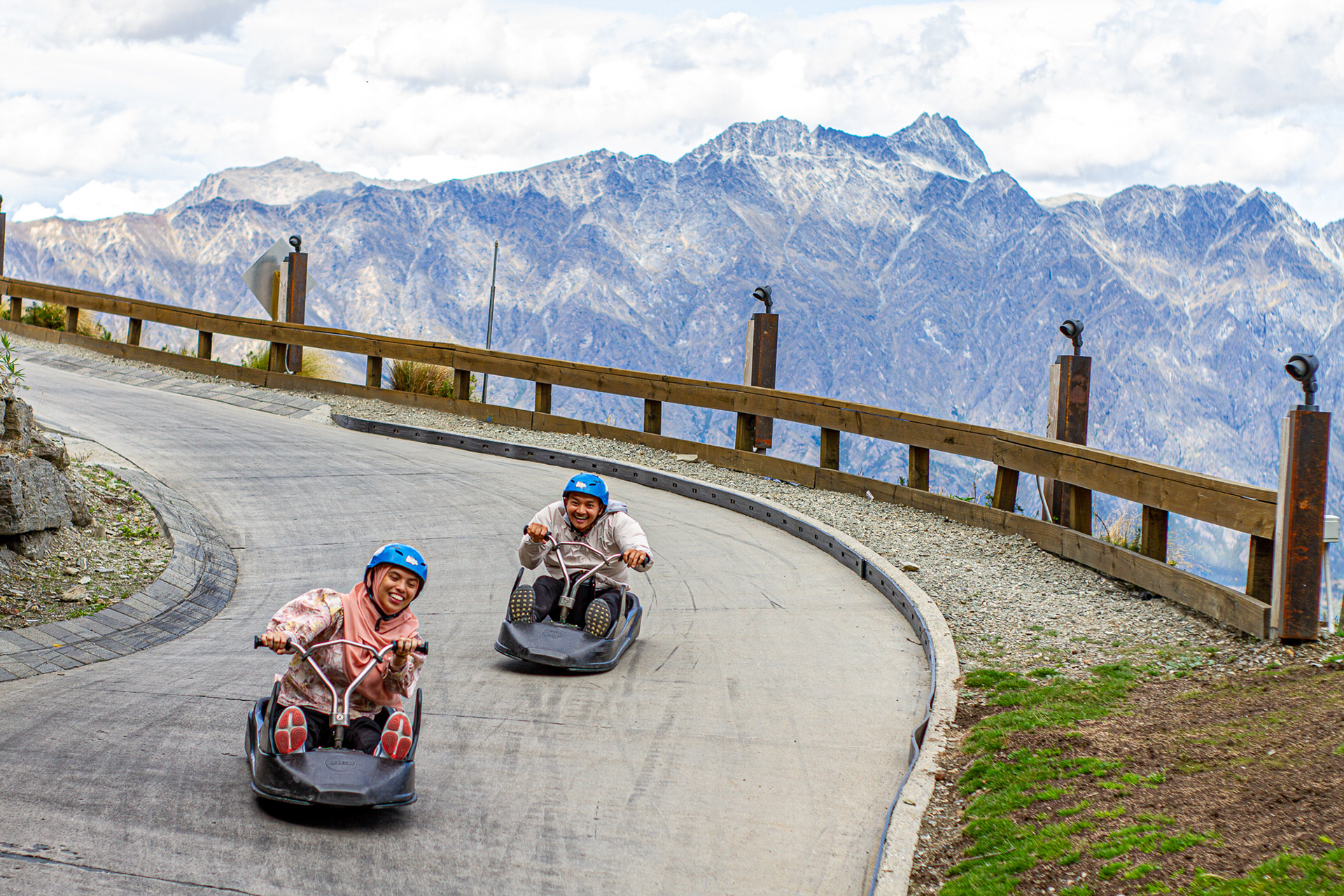 Best in Show, First Place in Feature Category | Two people race down the Queenstown Luge in Queenstown, New Zealand, Feb. 17, 2020.