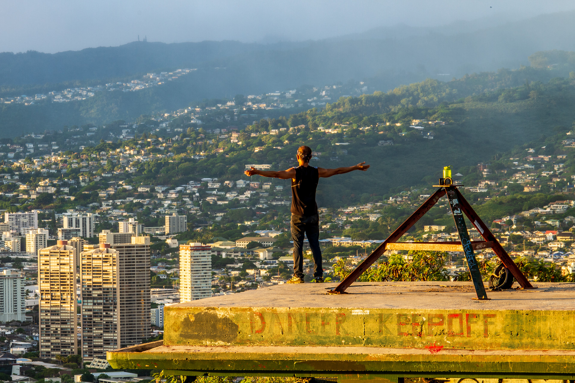 Steve Lin poses for a selfie on an abandoned structure at the top of the crater rim in Diamond Head State Monument in Honolulu, Hawaii, Dec. 27, 2019. Since the park’s entrance closed during this sunset, Lin took a treacherous climb along the top of the crater rim’s steep walls to the bottom with nothing more than a headlamp.