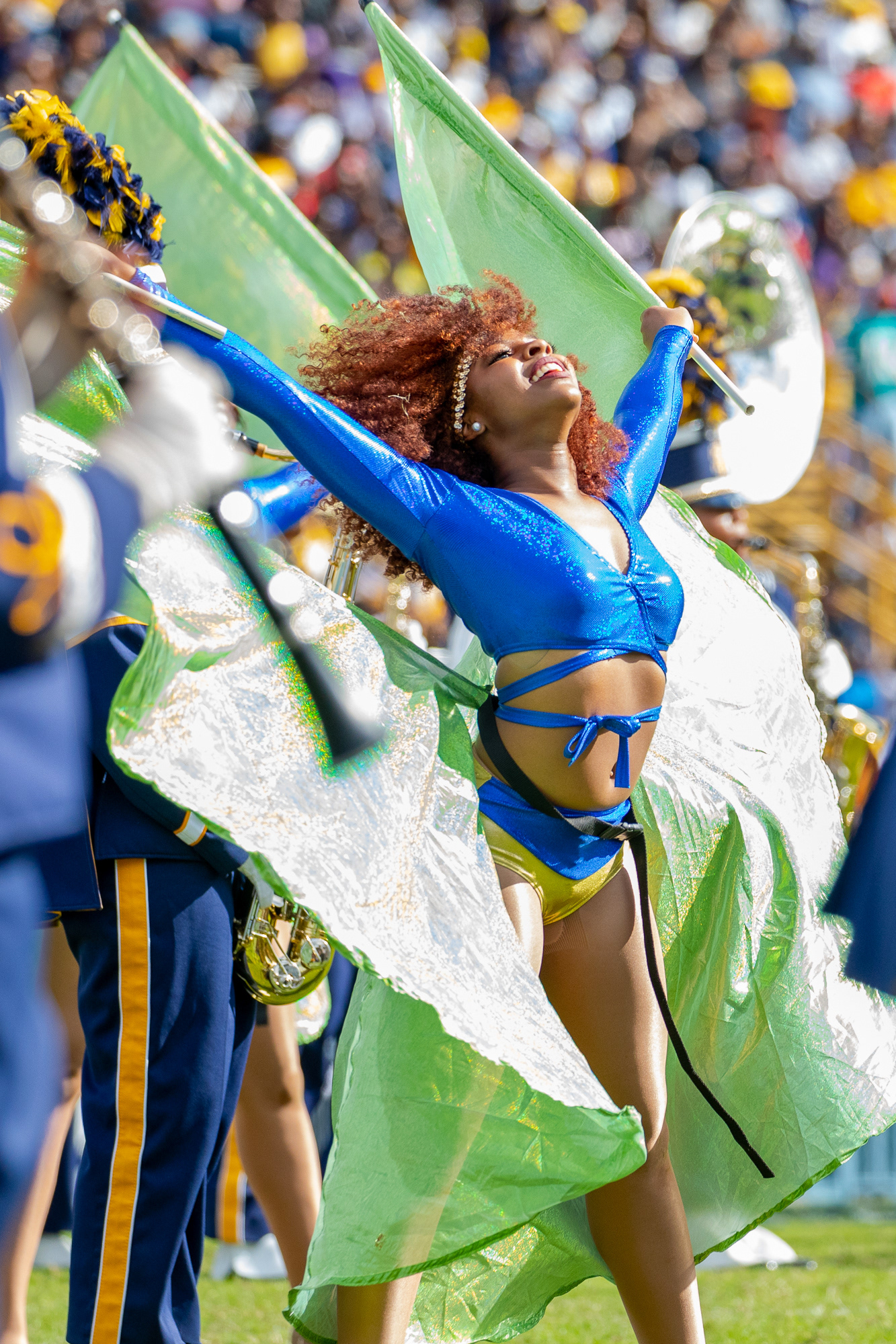 Honorable Mention in Sports Feature Category | An NC A&T color guard member waves two flags behind her during the halftime show in BB&T Stadium in Greensboro, N.C., Saturday, Oct. 26, 2019. The Bulldogs beat the Howard Bison 64-6 in their homecoming game.