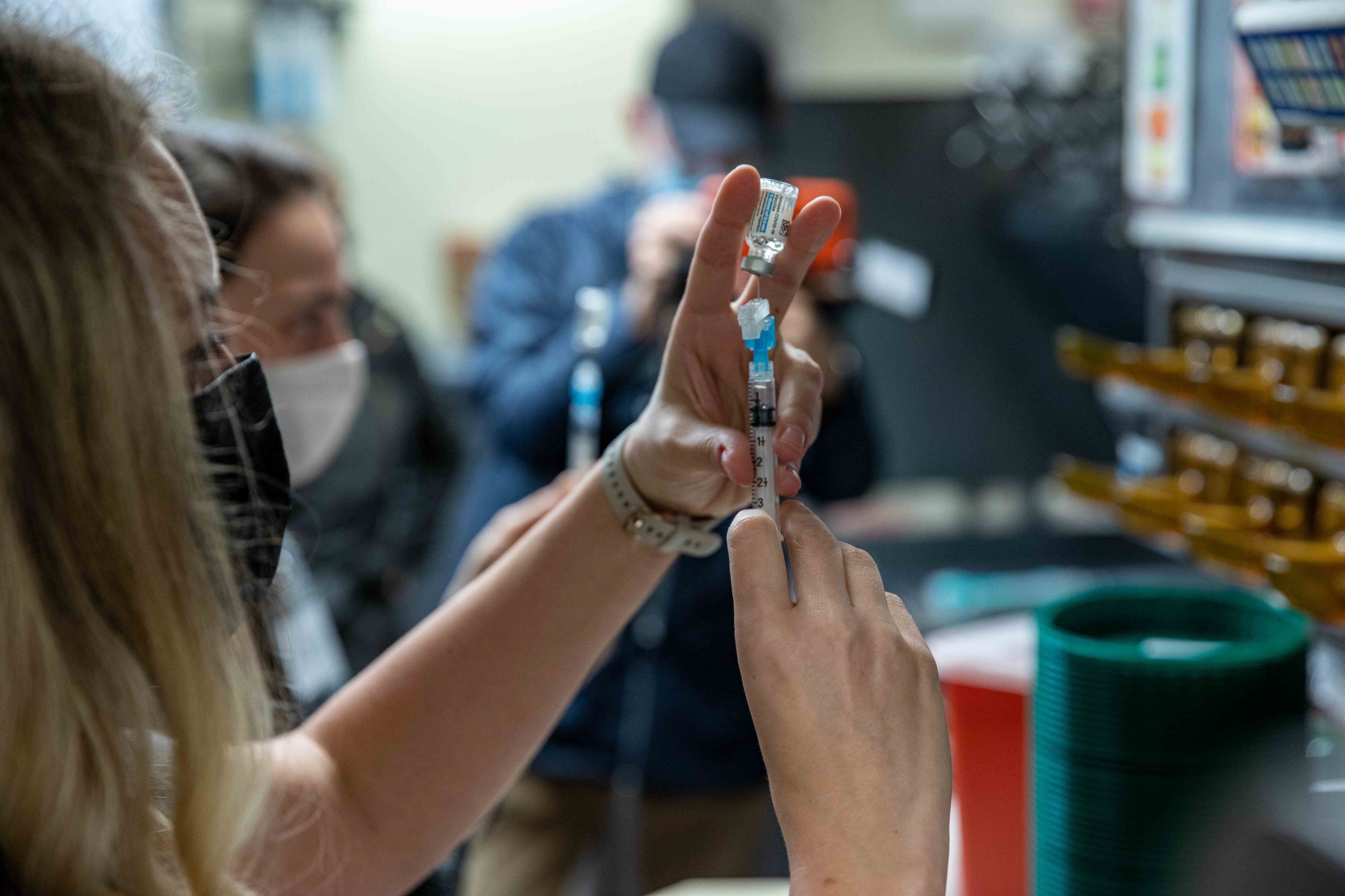 UNC pharmacists fill syringes with vaccine doses in the former Wendy’s in the bottom of the Student Union. The prepared syringes are placed on steel countertops under shelves where burgers and fries had been kept just a year prior.