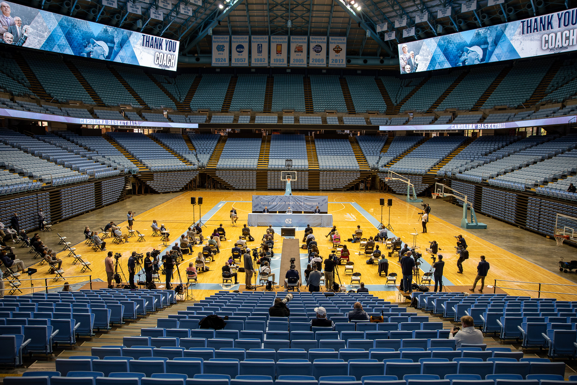 UNC hosts a press conference to announce the retirement of basketball head coach Roy Williams in the Dean Smith Center on April 1, 2021. The public was not allowed to attend because of coronavirus restrictions, and reporters were required to wear masks and socially distance.