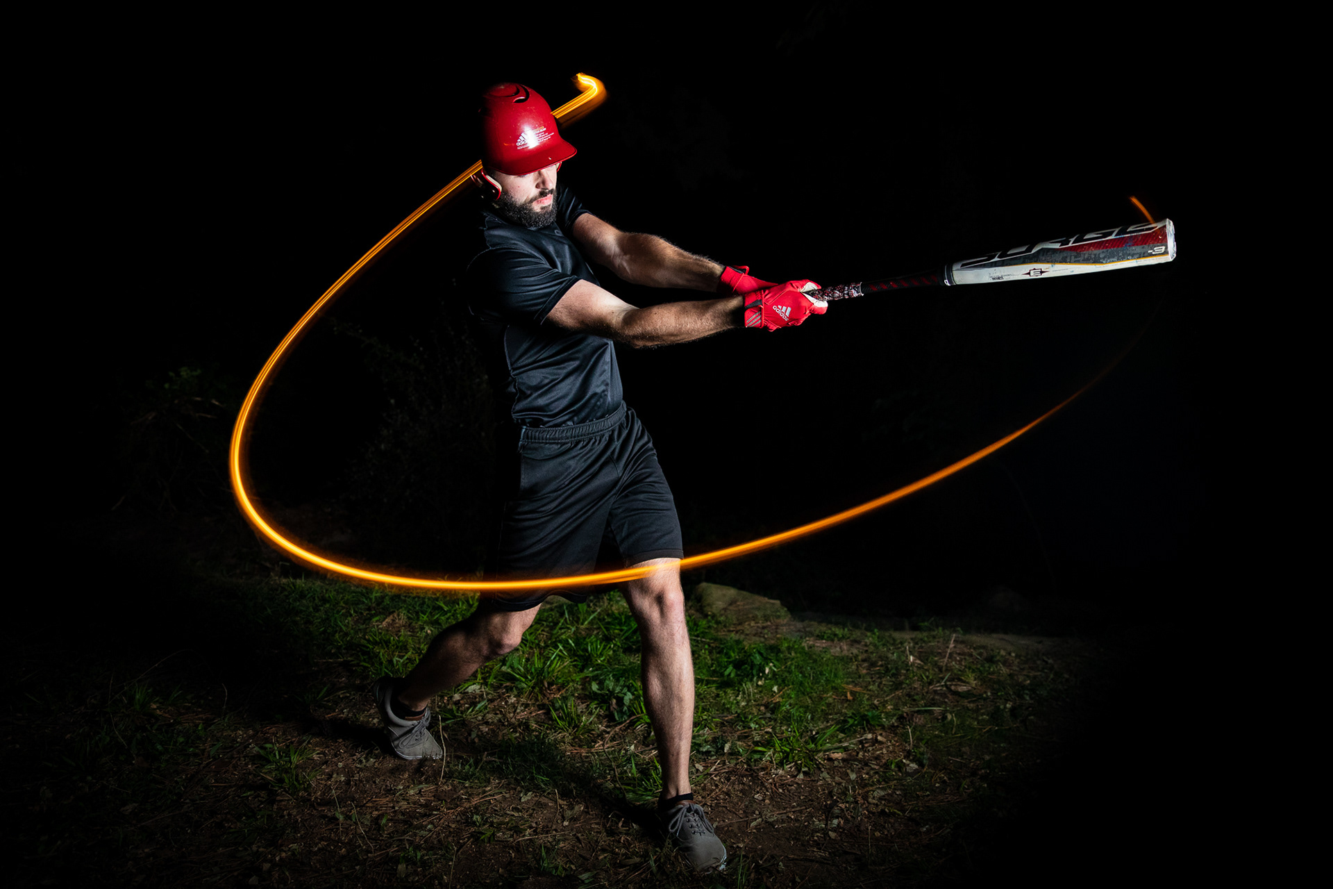 Abe Loven swings a baseball bat for a self-portrait in Chapel Hill, N.C., Sept. 22, 2020.