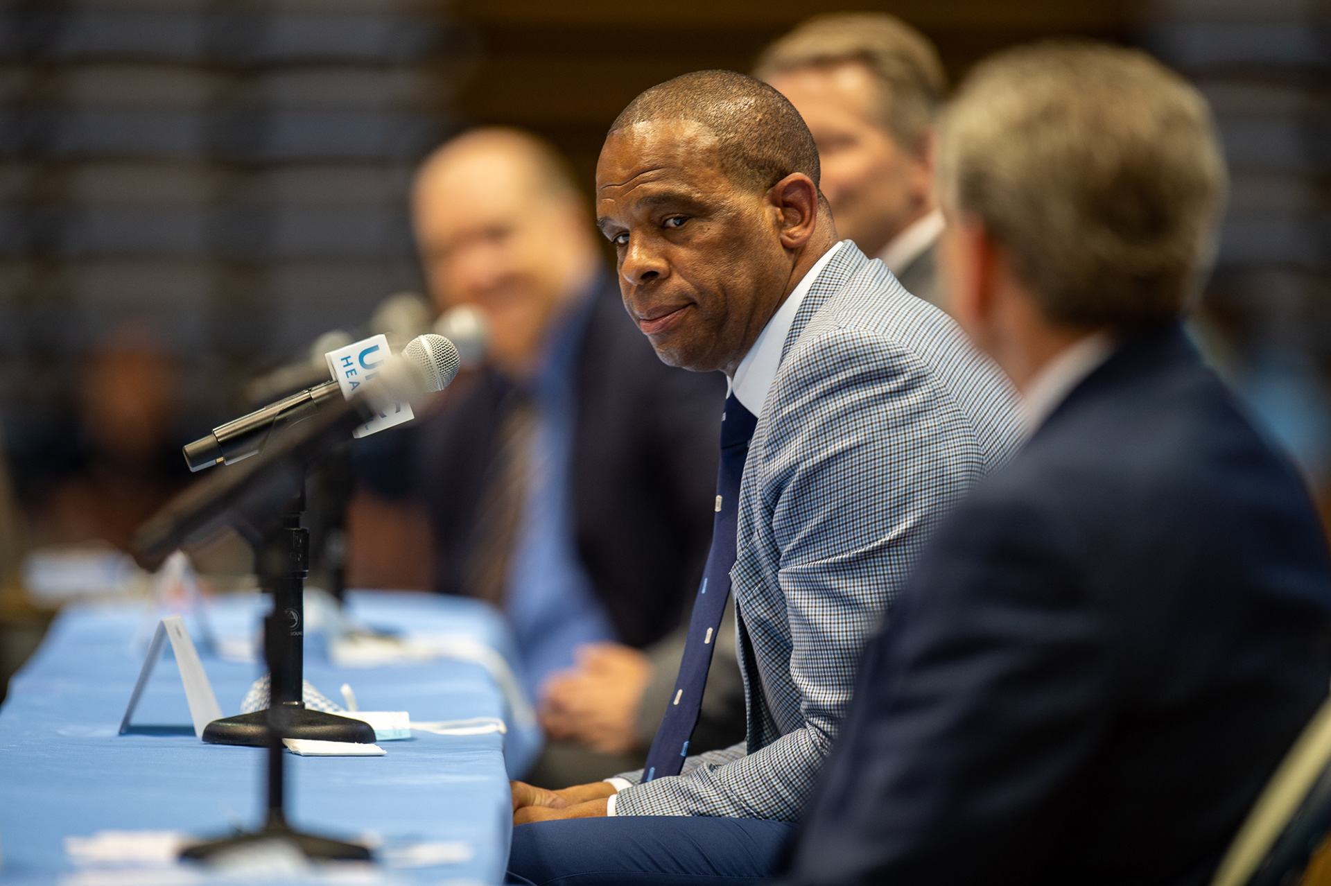 Hubert Davis talks to reporters at a press conference announcing that he will be the next head coach of the UNC men’s basketball team in the Dean Smith Center on April 1, 2021. Davis replaces legendary Tar Heel coach Roy Williams, who retired just a week earlier.