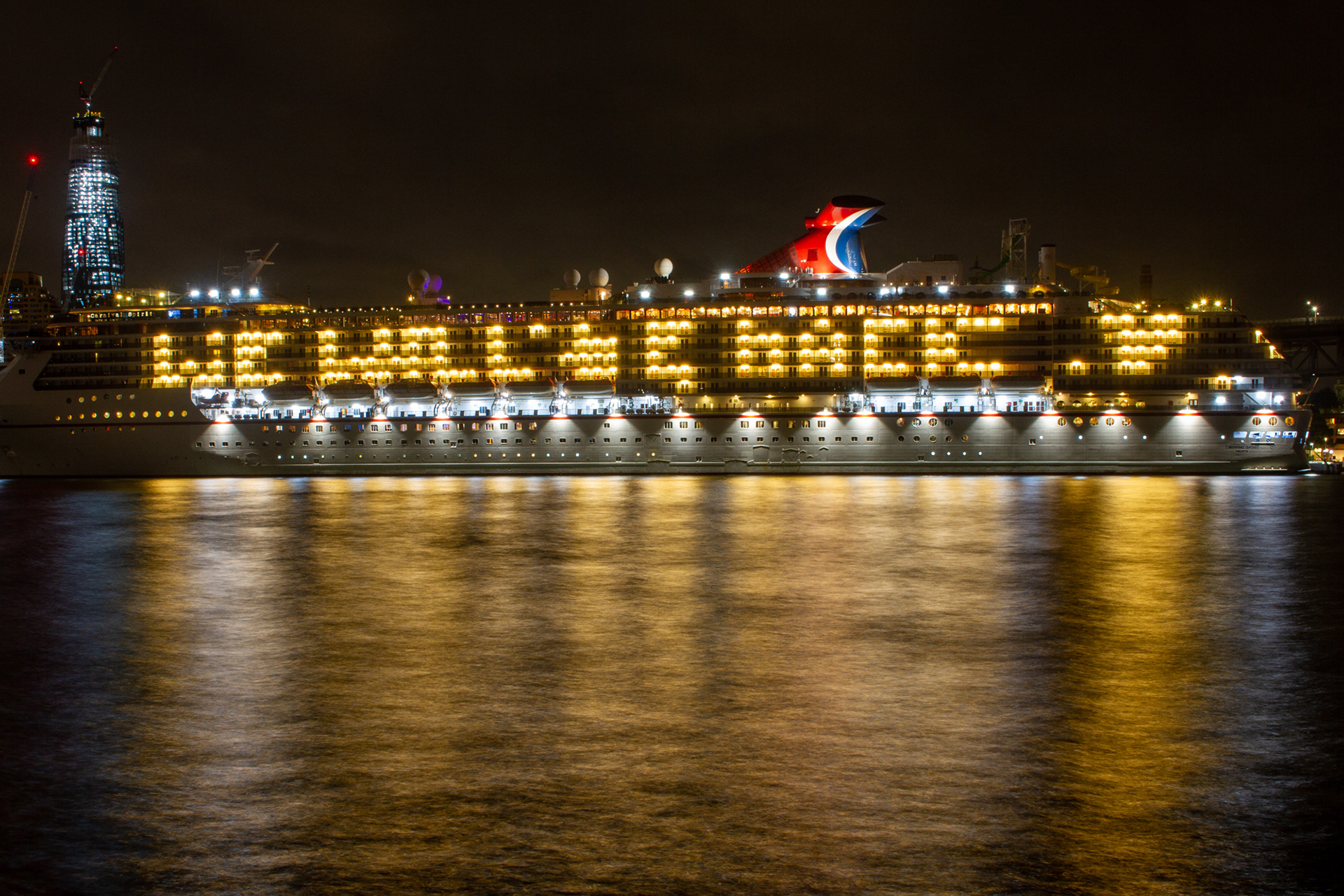 "We Will Be Back." After Carnival Australia cancelled all cruises through mid-May, the Carnival Spirit lies docked in Circular Quay in Sydney, March 21, 2020. Despite a nationwide ban on international air travel due to the coronavirus pandemic, cruise ships with sick passengers have been allowed to dock. Sydneysiders were outraged after the Ruby Princess disembarked 2,700 passengers in Circular Quay without health screening on March 19. Nine days later, 299 of her passengers had tested positive for COVID-19.