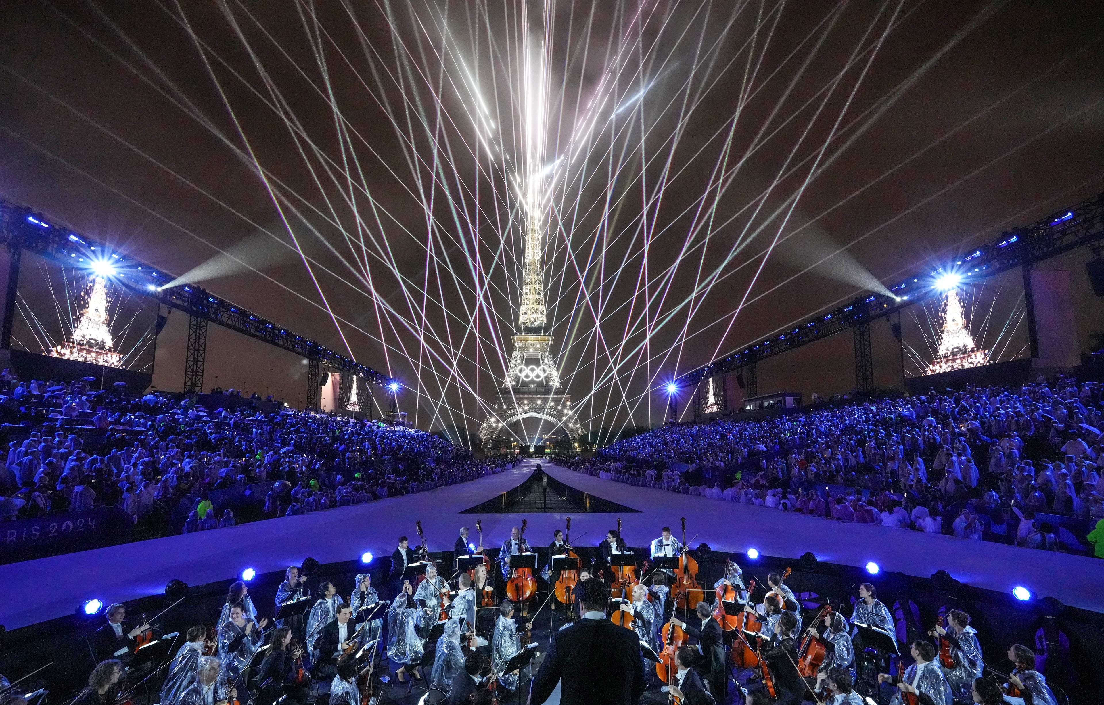 The Paris 2024 Olympic Opening Ceremony unfolded along the Seine River, culminating in a breathtaking finale. As Celine Dion sang 'Hymne à l'amour,' laser beams illuminated the night sky, creating a dazzling spectacle