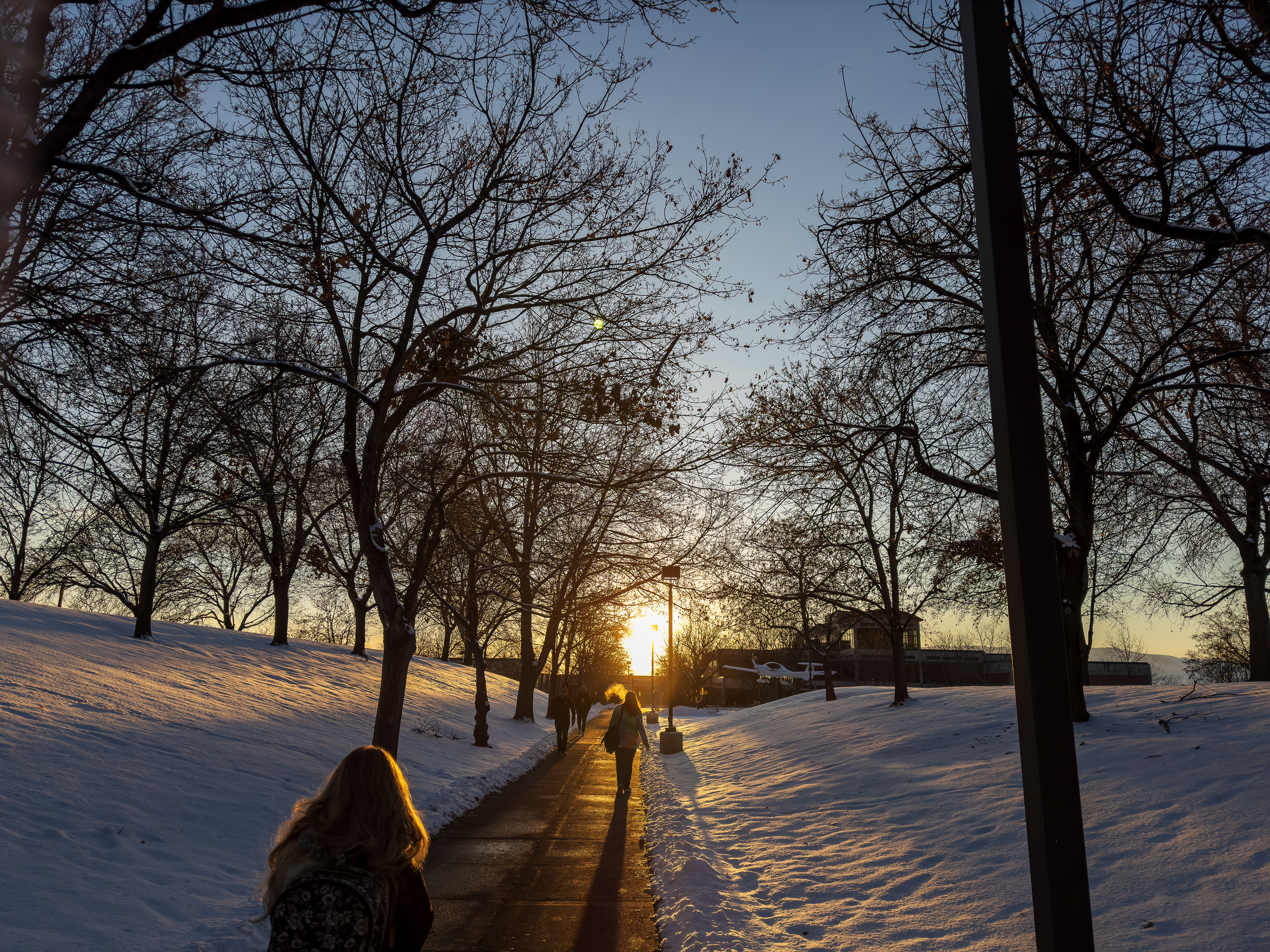 Frosty Horizon: Campus Sunset Blanketed in Snow