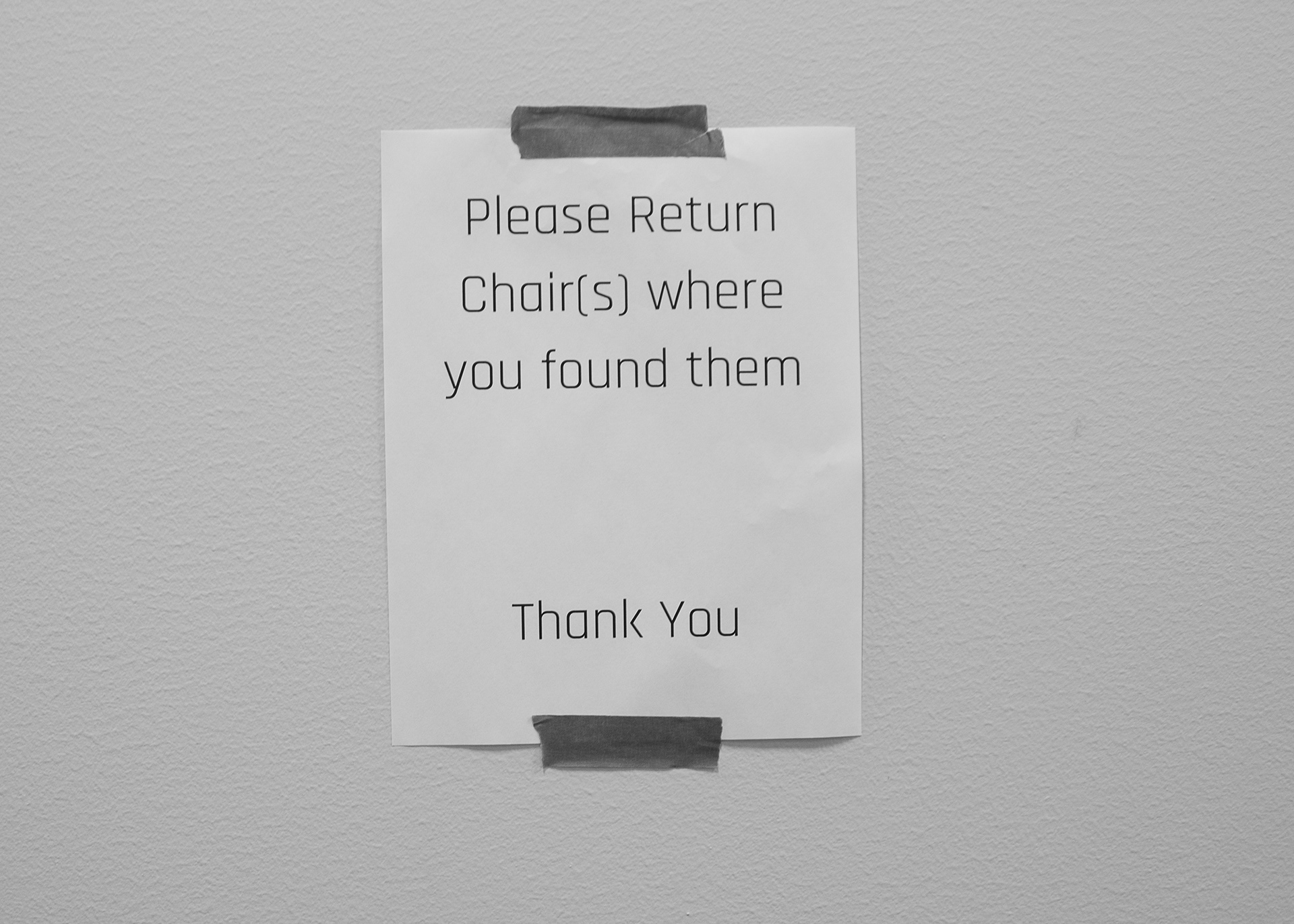 Etiquette Echoes: A Monochrome Plea for Chair Courtesy