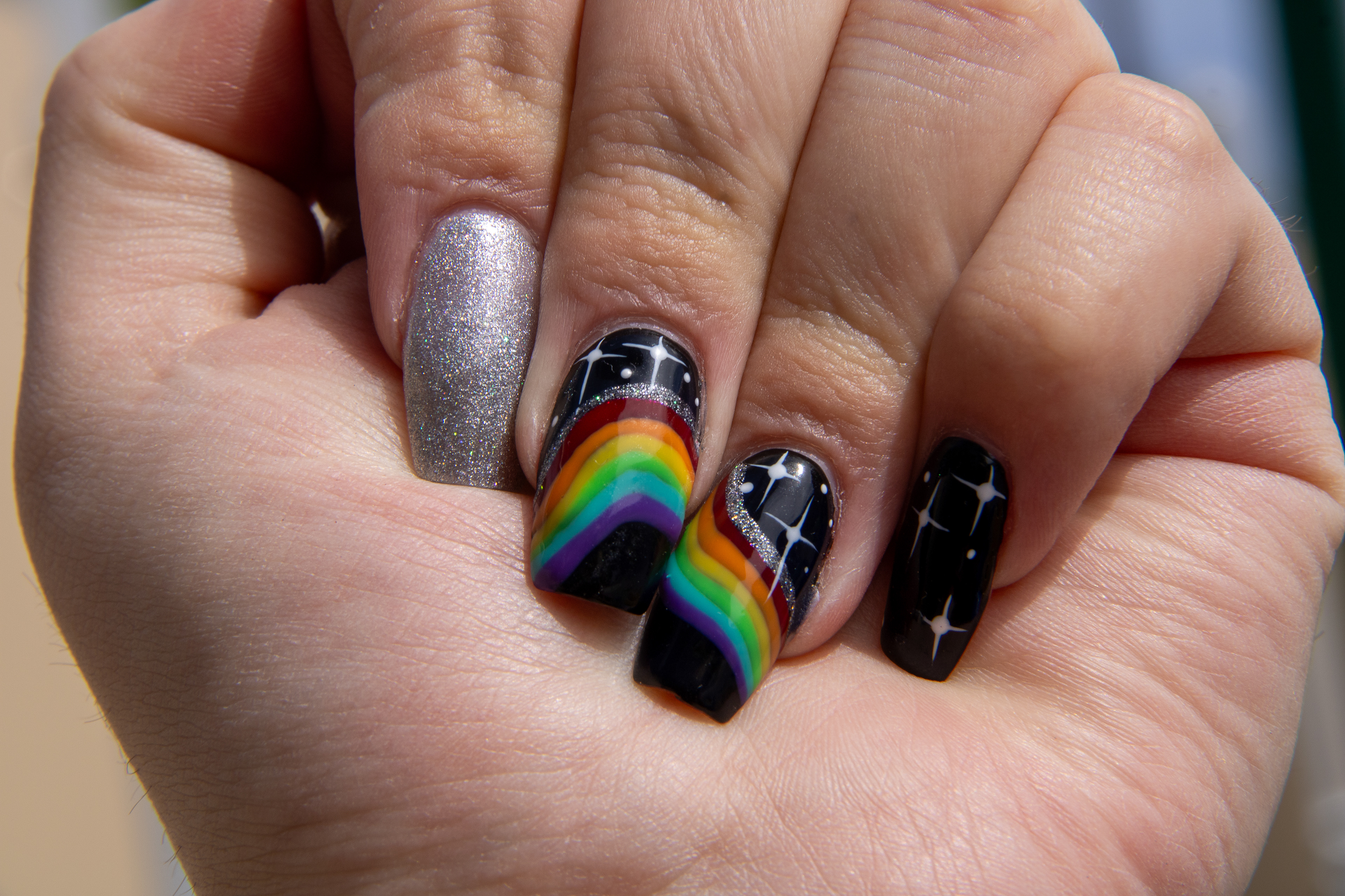 Starry Spectrum: Radiant Nails on a Midnight Canvas