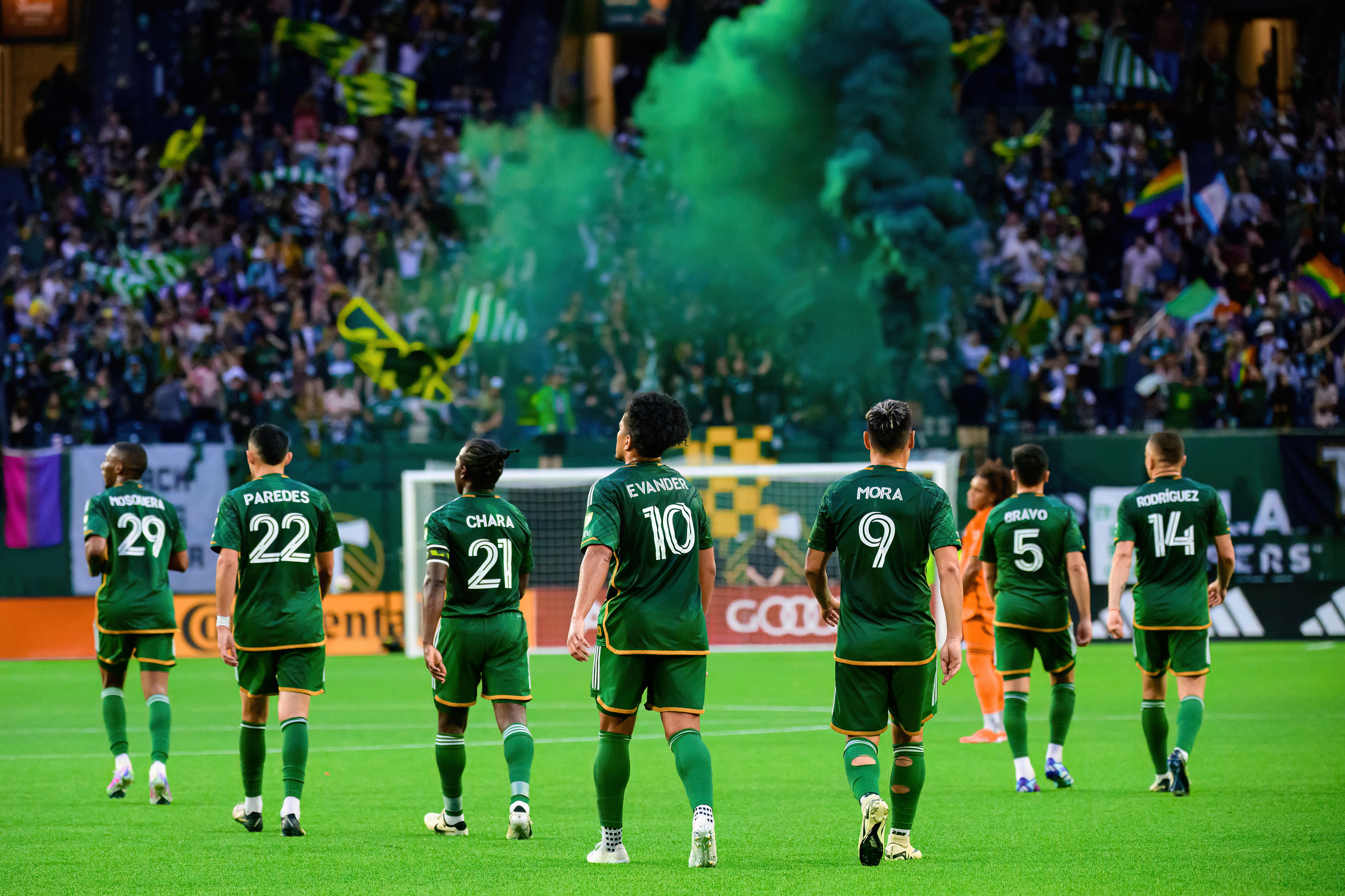Portland Thorns FC players walk towards midfield after scoring a goal during their match against Houston Dynamo FC at Providence Park in Portland, Ore., on Jun. 1, 2024.