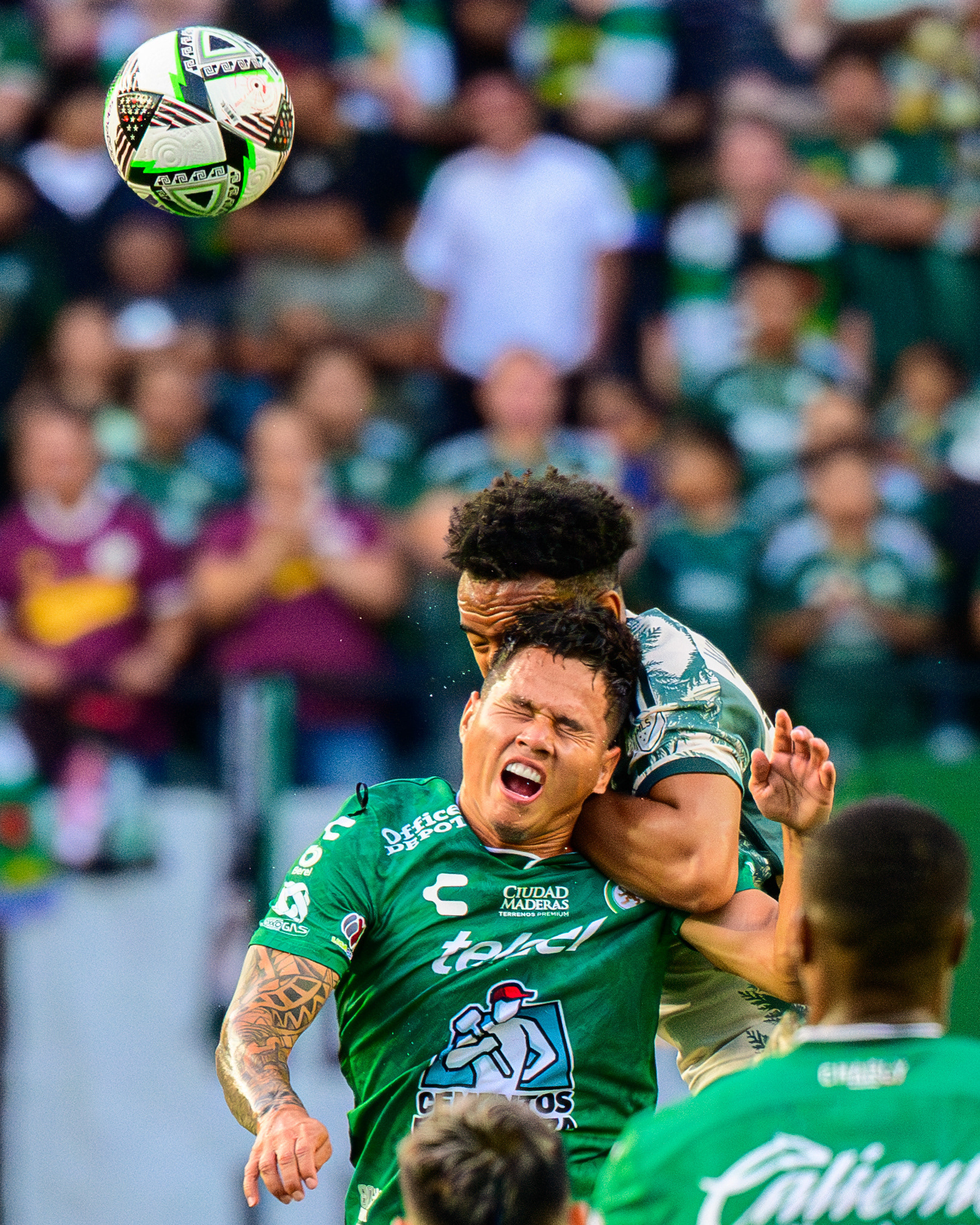 León Midfielder Jordy Alcivar (13) fights for control of the ball in the air with Portland Thorns FC midfielder Eryk Williamson (19) during a Leagues Cup match where Portland Thorns FC of the MLS defeated Club León of Liga MX 2-1 at Providence Park in Portland, Ore., on Jul. 28, 2024.