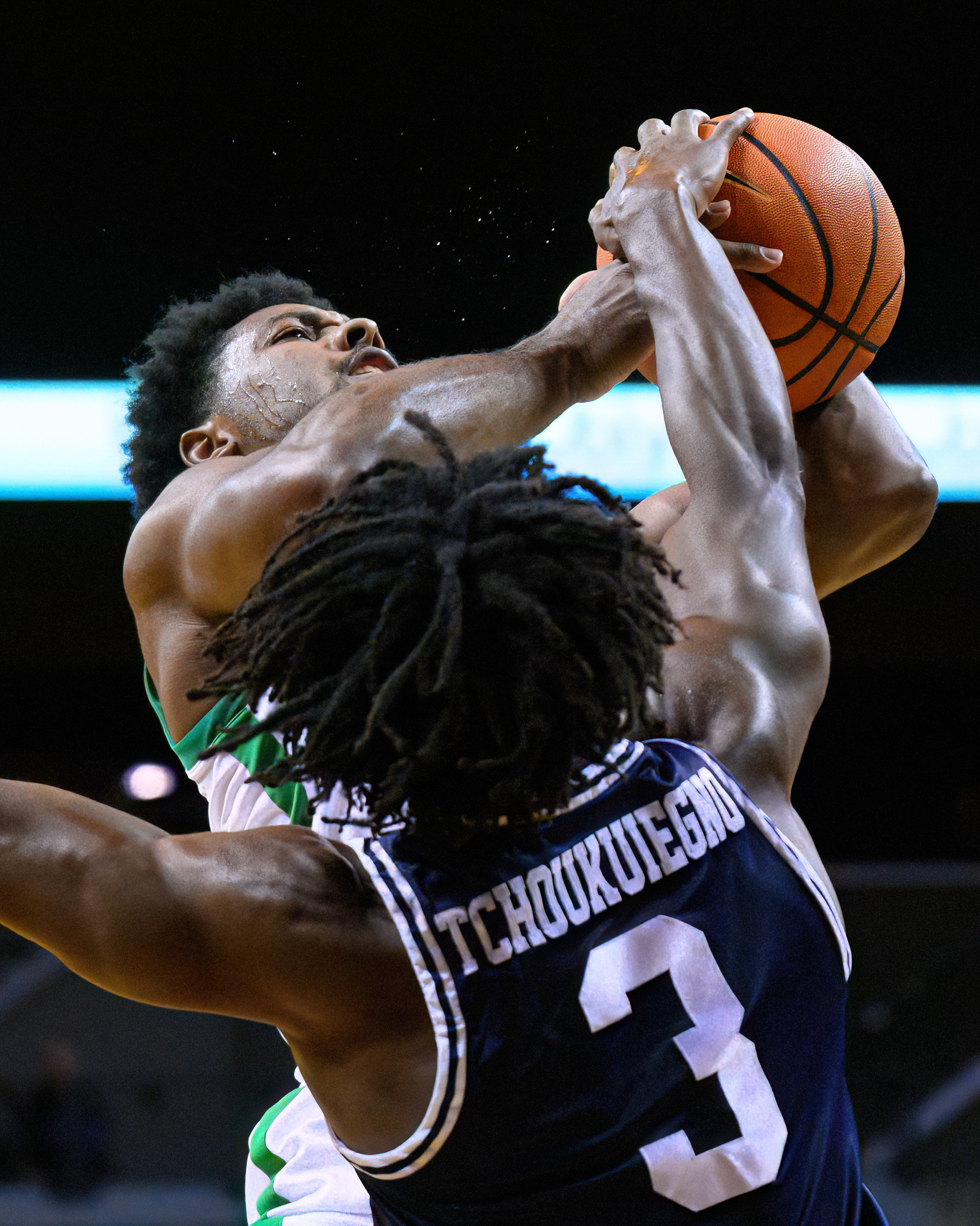 Oregon Ducks guard Kario Oquendo (0) shoots while covered by California Baptist Lancer guard Blondeau Tchoukuiegno (3) in a game at Matthew Knight Arena in Eugene, Ore., on Dec. 12, 2023.