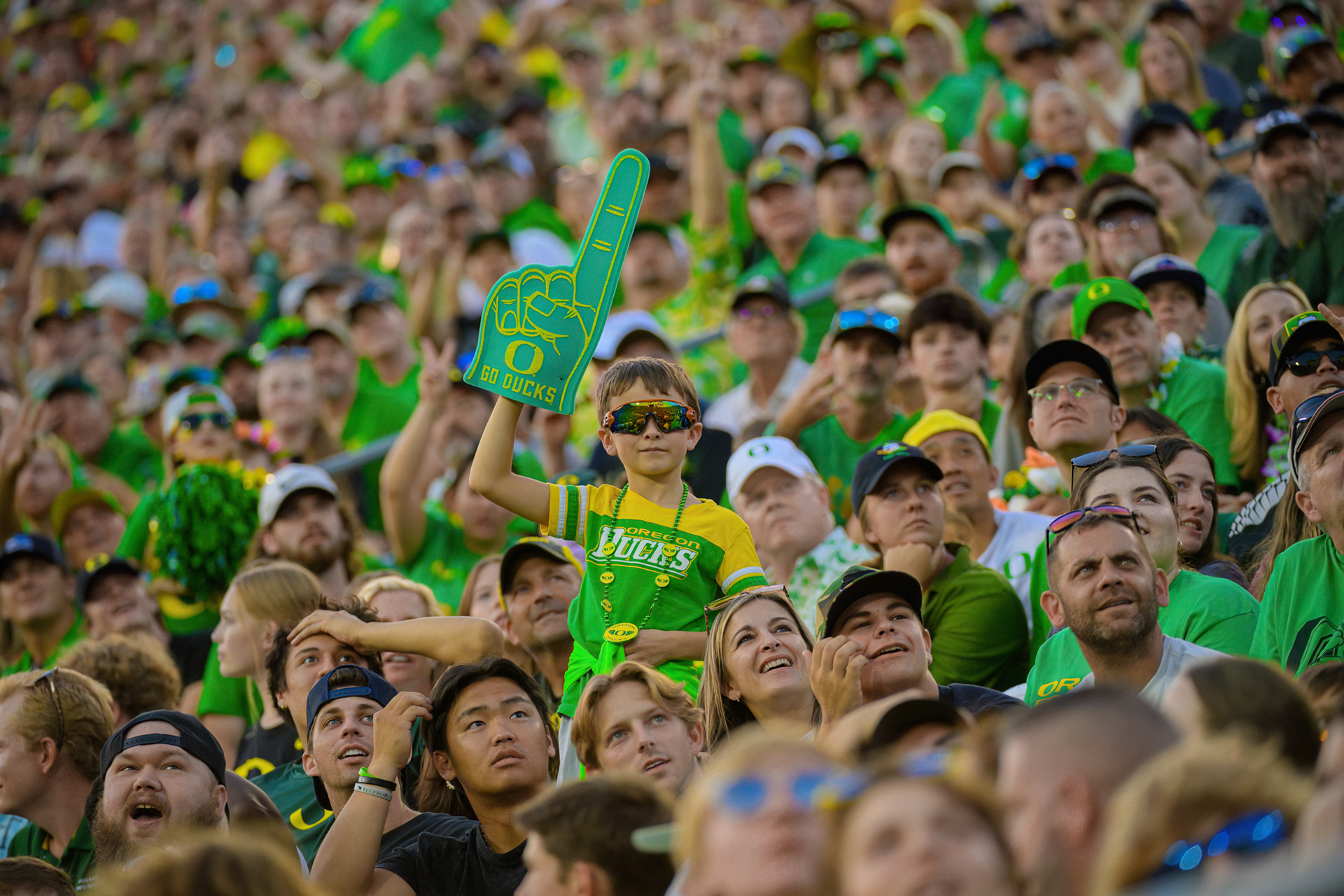 A spectator waves a foam finger in the stands during a game where the University of Oregon Ducks Football team defeated the University of Hawaii Rainbow Warriors 55-10 at Autzen Stadium in Eugene, Ore., on Sept. 16, 2023.