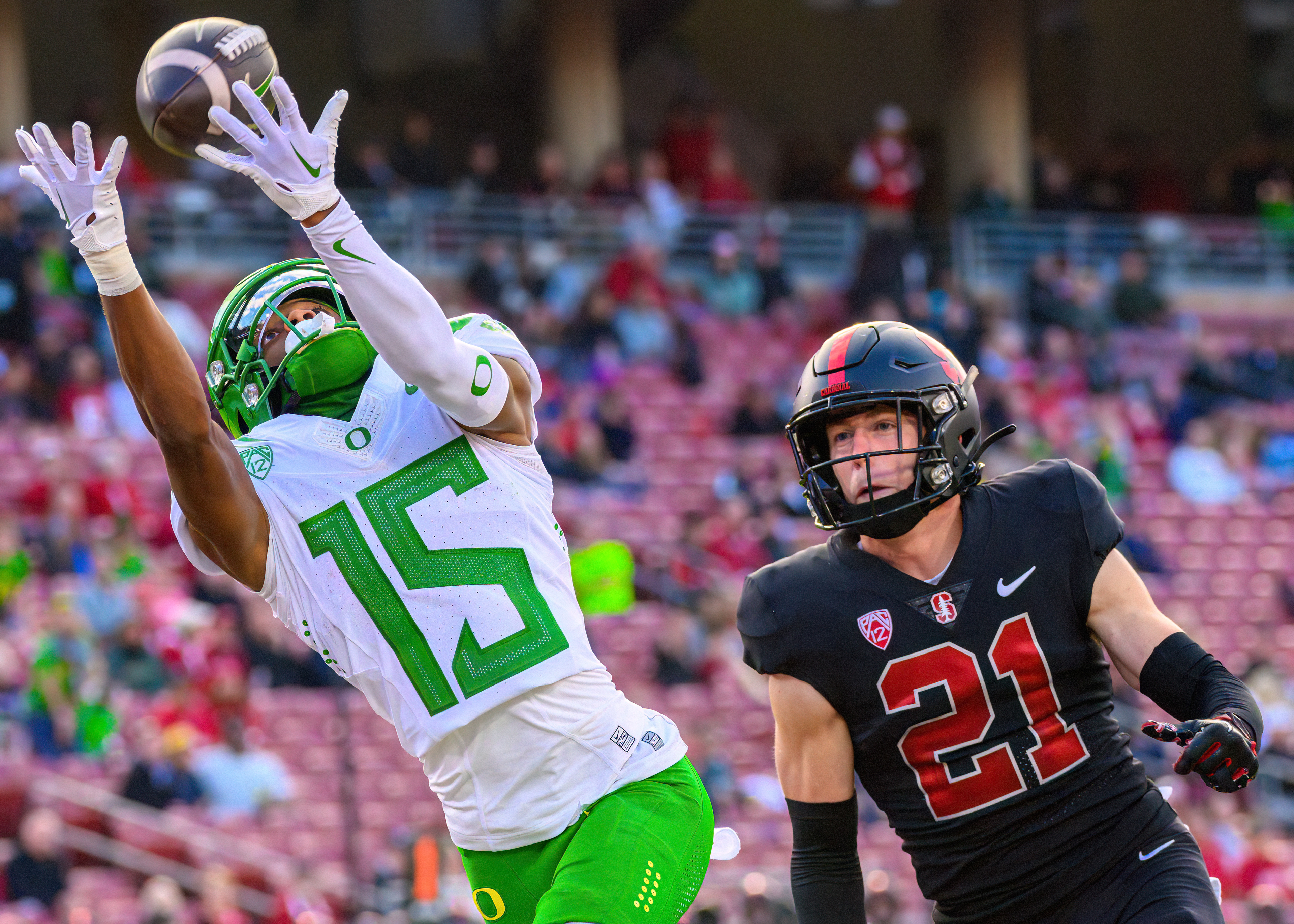 Oregon Ducks wide receiver Tez Johnson (15) separates from Stanford Cardinals safety Scotty Edwards (21) while attempting to make a catch in the endzone in a game at Stanford Stadium in Stanford, Calif., on Sept. 30, 2023. 