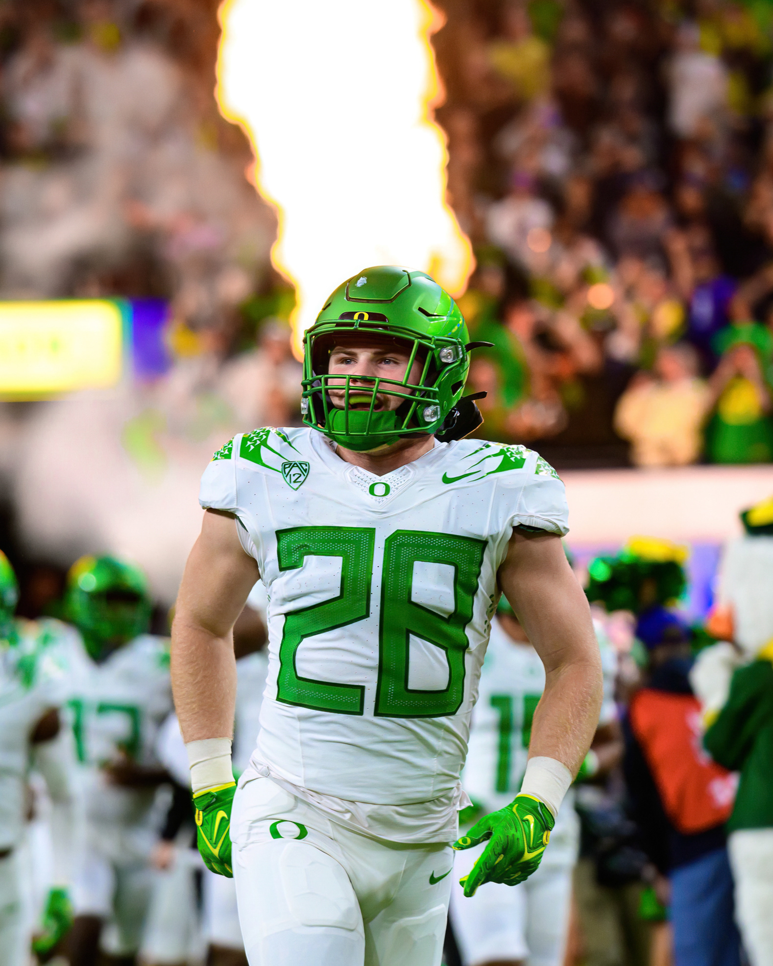 Oregon Ducks linebacker Bryce Boettcher (28) runs onto the field before the PAC 12 Championship game against the Washington Huskies at Allegiant Stadium in Las Vegas, Nev., on Dec. 1, 2023. 
