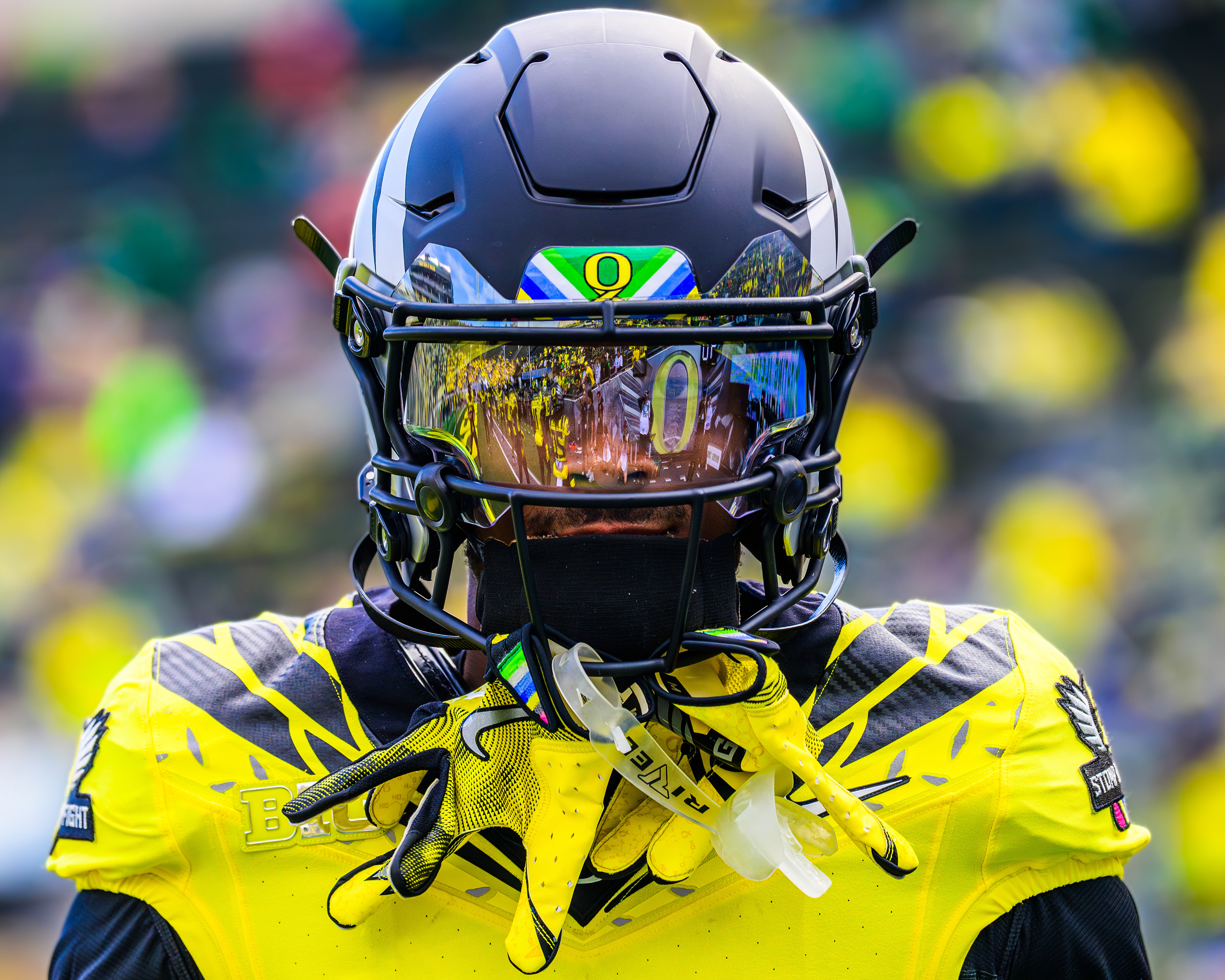 Oregon Ducks wide receiver Tez Johnson, #15, warms up in the unique "Heroes Uniform," designed to bring support and raise awareness for cancer patients before a home game against the University of Illinois Fighting Illini at Autzen Stadium in Eugene, Ore., on Oct. 26, 2024. Known for its close relationship with Nike, the University of Oregon Football team has access to hundreds of uniform styles and unveils a new combination each week of their season. 