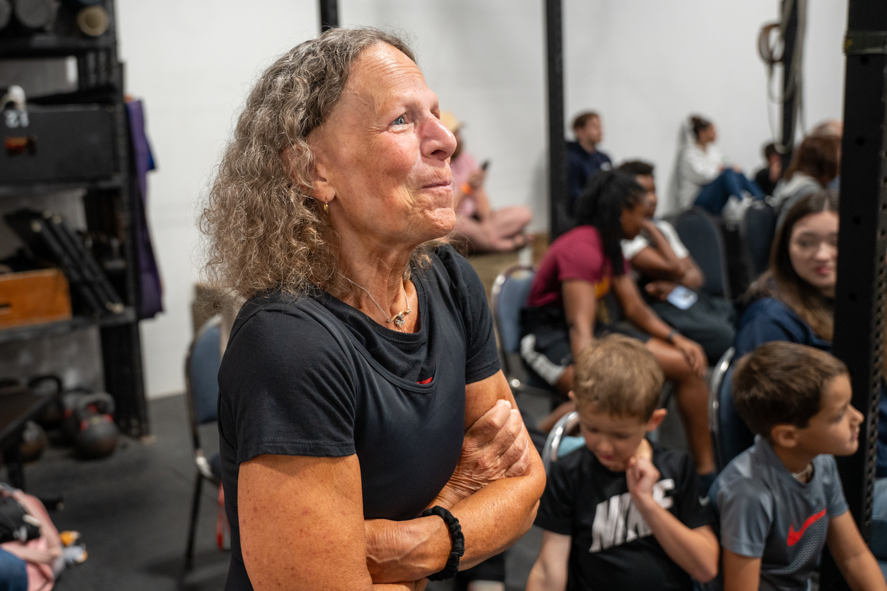 Peggy Tirrell watches during the opening remarks at USA Powerlifting Rochester Rumble V  in Henrietta , NY on Sept. 9, 2023. Tirrell at 71 years is the current state of New York powerlifting champion in her group.