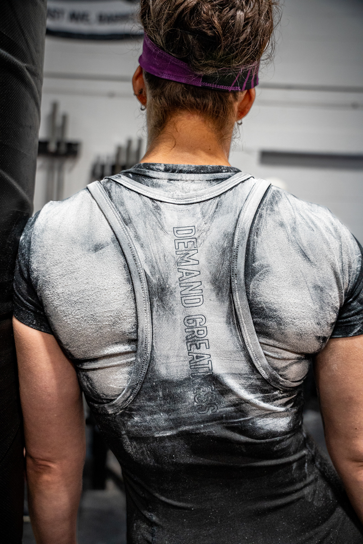Allison Fitzsimmons at USA Powerlifting Rochester Rumble V  in Henrietta , NY on Sept. 9, 2023.  Lifters put chalk on their backs to add grip to the bar during the squat portion of the competition. 