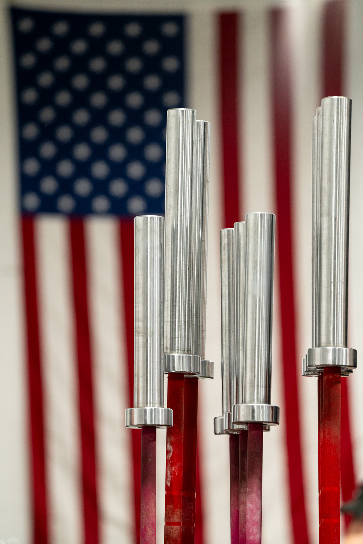 The United States flag hangs inside the East Barbell gym during the Rochester Rumble V powerlifting competion.