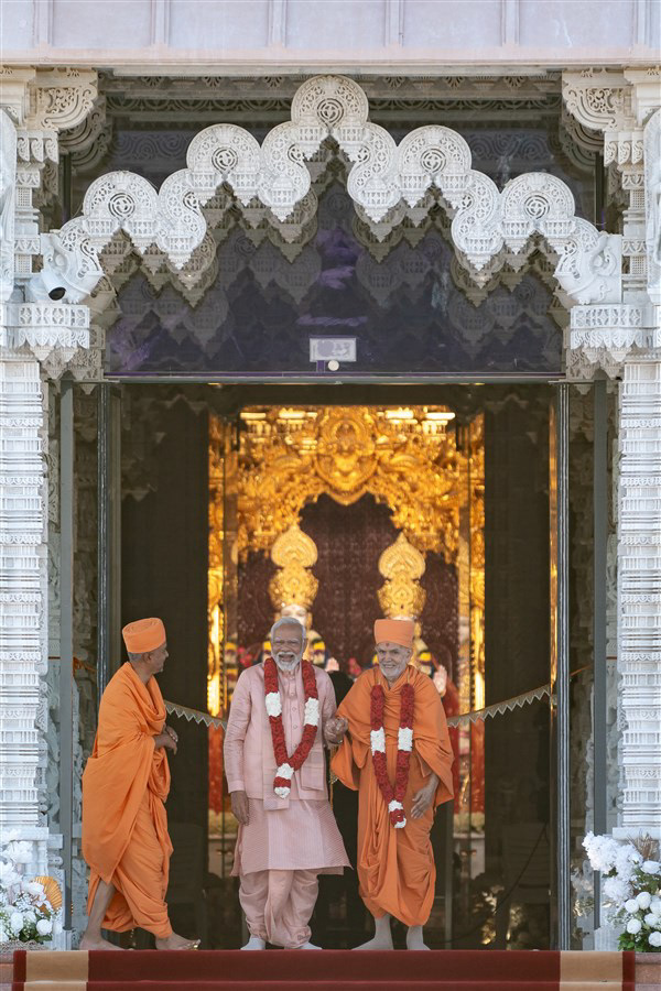 Prime Minister Modi stood atop the steps of the Mandir with Mahant Swami Maharaj and Brahmaviharidas Swami during the opening of the BAPS Hindu Mandir in Abu Dhabi.