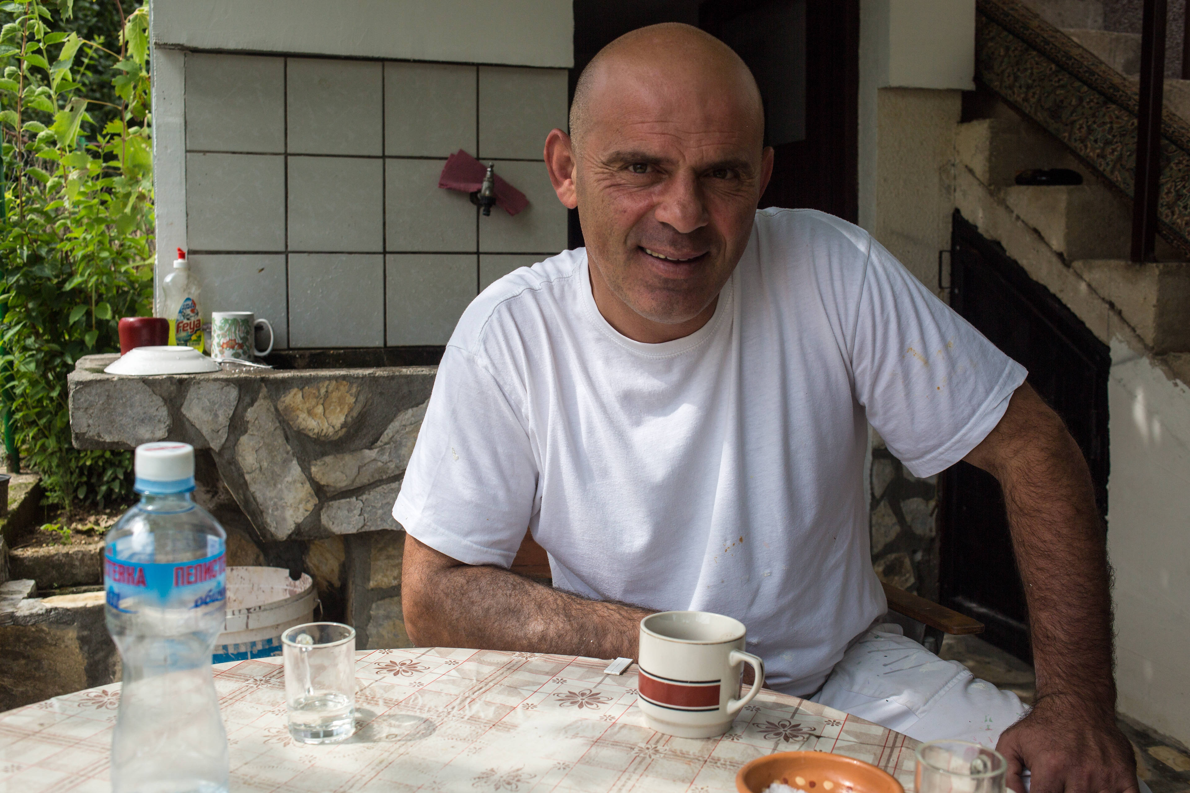 It was Sunday and we were wandering the streets of Macedonia Brod looking for a place to eat. I asked this man if he could point me in the right direction. Instead he invited me into his home and his mother quickly prepared coffee, while the father fetched the rakiya. As we drank they harvested some tomatoes, peppers and corn from their small garden and served them to us with big hunk of Sirene cheese from their farm outside of the town. Sirene is a brined cheese like feta. We could not have asked for better meal.