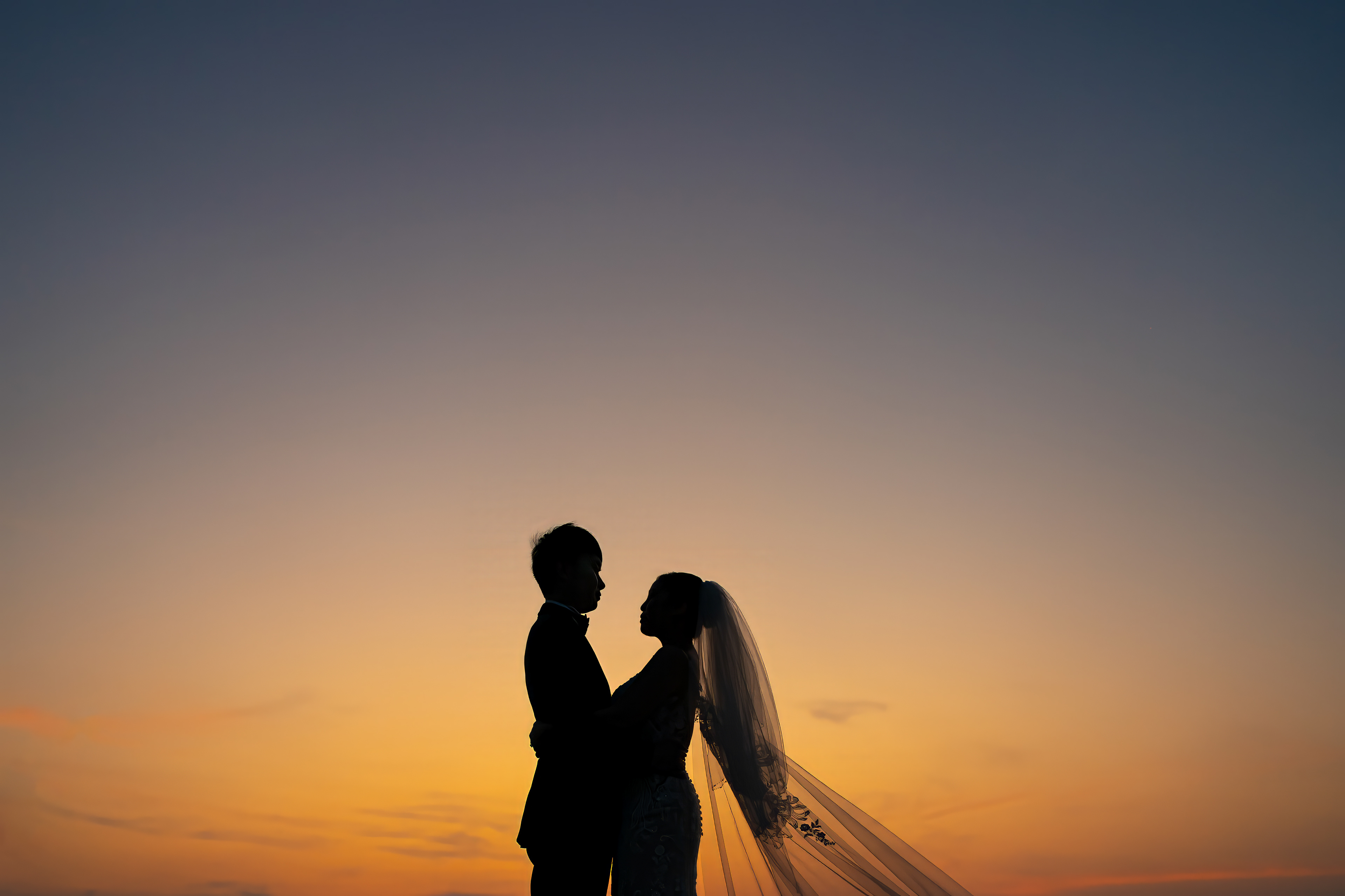 Silhouette of bride and groom during sunset after the wedding, Phuket Krabi Samui Phang nga Thailand wedding photographer photographing wedding photography of a beautiful beach wedding in Phuket