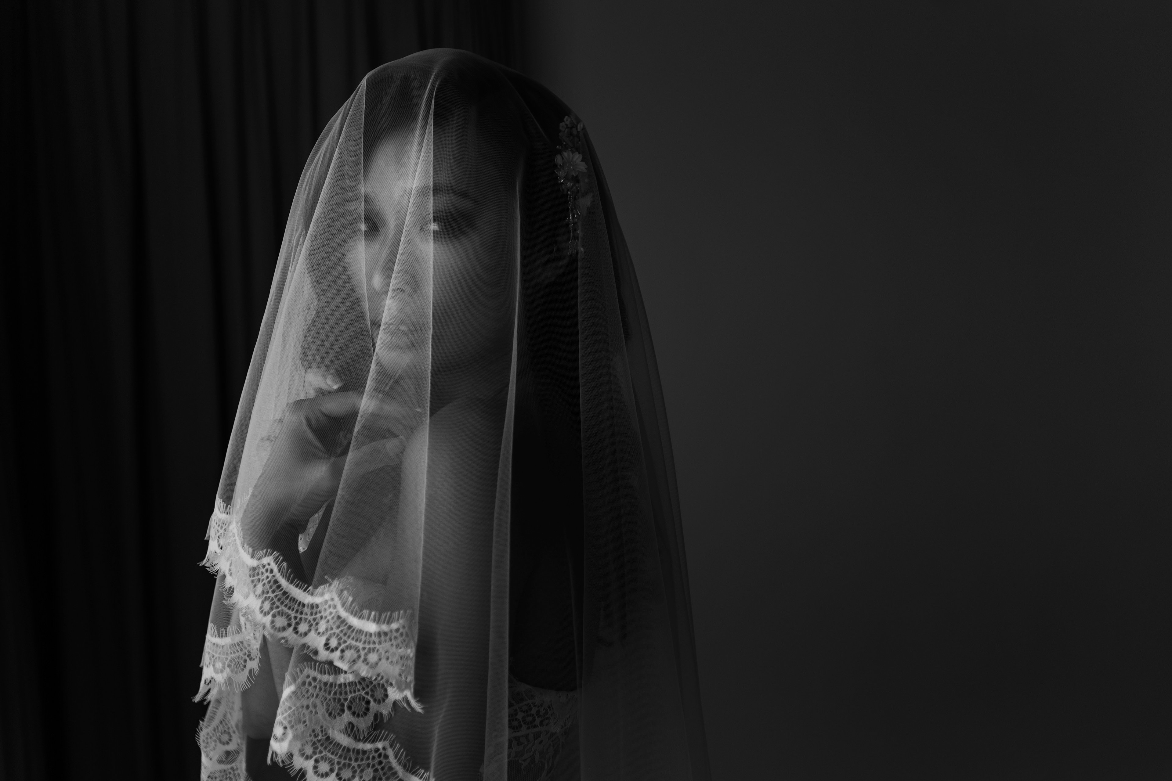 Bride covered in her vail over the shoulder portrait photographed at Sava Beach Villas Phuket