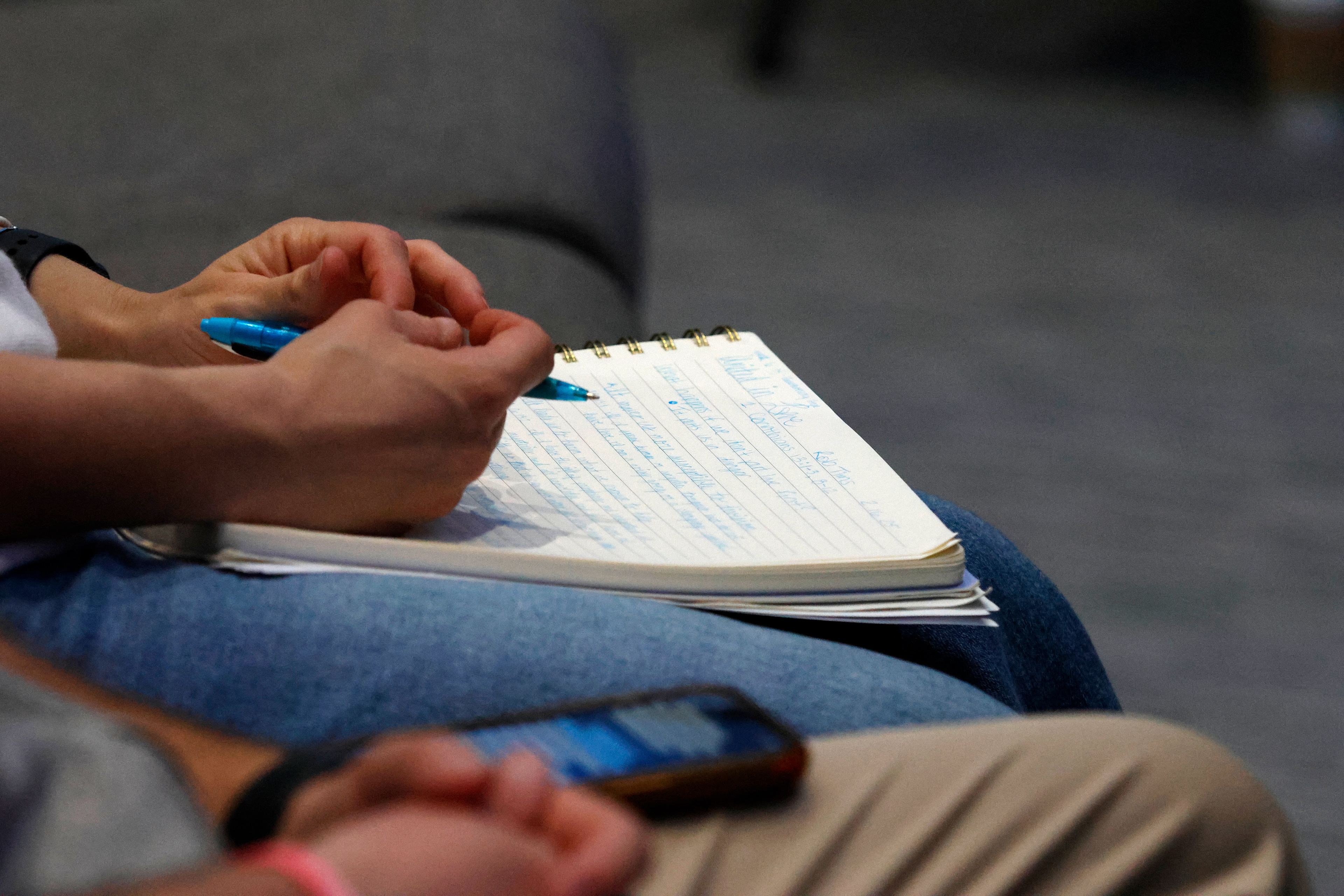 Jordan Crumbley has her notebook ready to take notes during Sunday Worship at Beech Haven Church in Athens, Georgia, on Sunday, February 16, 2025. The Crumbleys regularly attend Sunday Worship in person. 