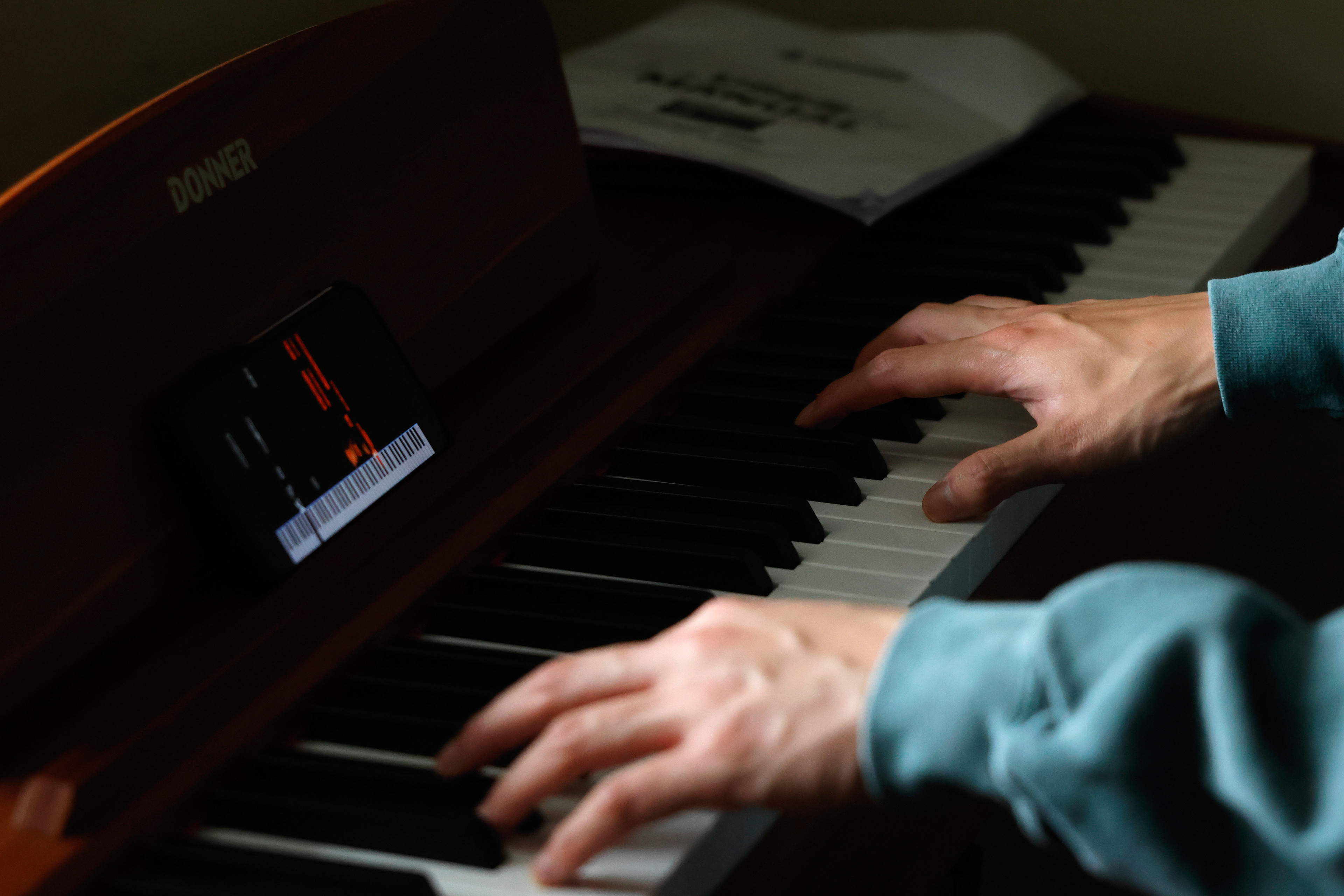 Andrew Hsu practices the piano in his apartment in Athens, Georgia, on Wednesday, April 2, 2025. Hsu tries to learn one new song every week.