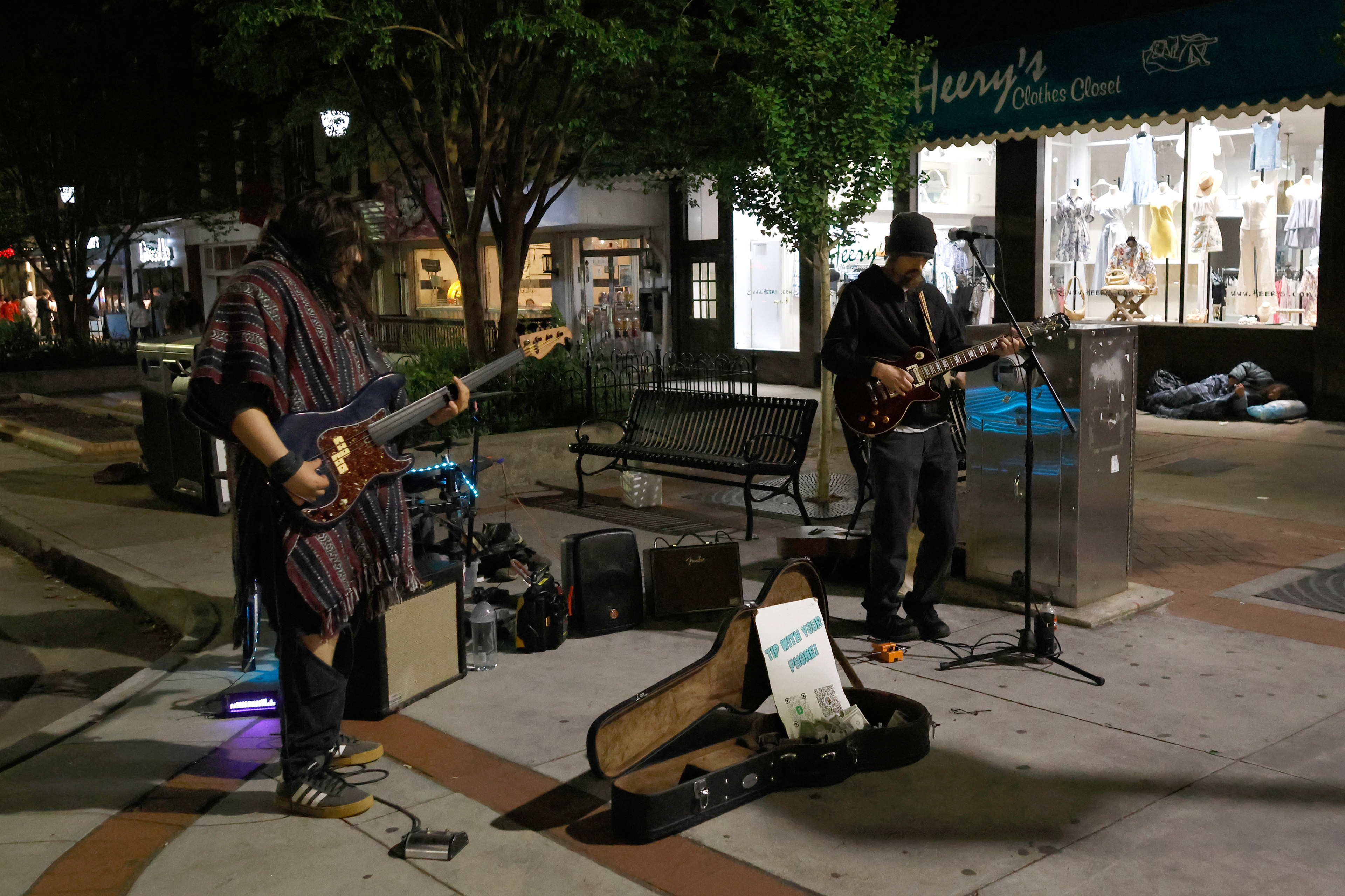 Clint Bussey and his band perform in downtown Athens, Georgia, on Saturday, April 12, 2025. Street performer Andrew Hsu knows Bussey and other street performers that regularly perform in downtown Athens.