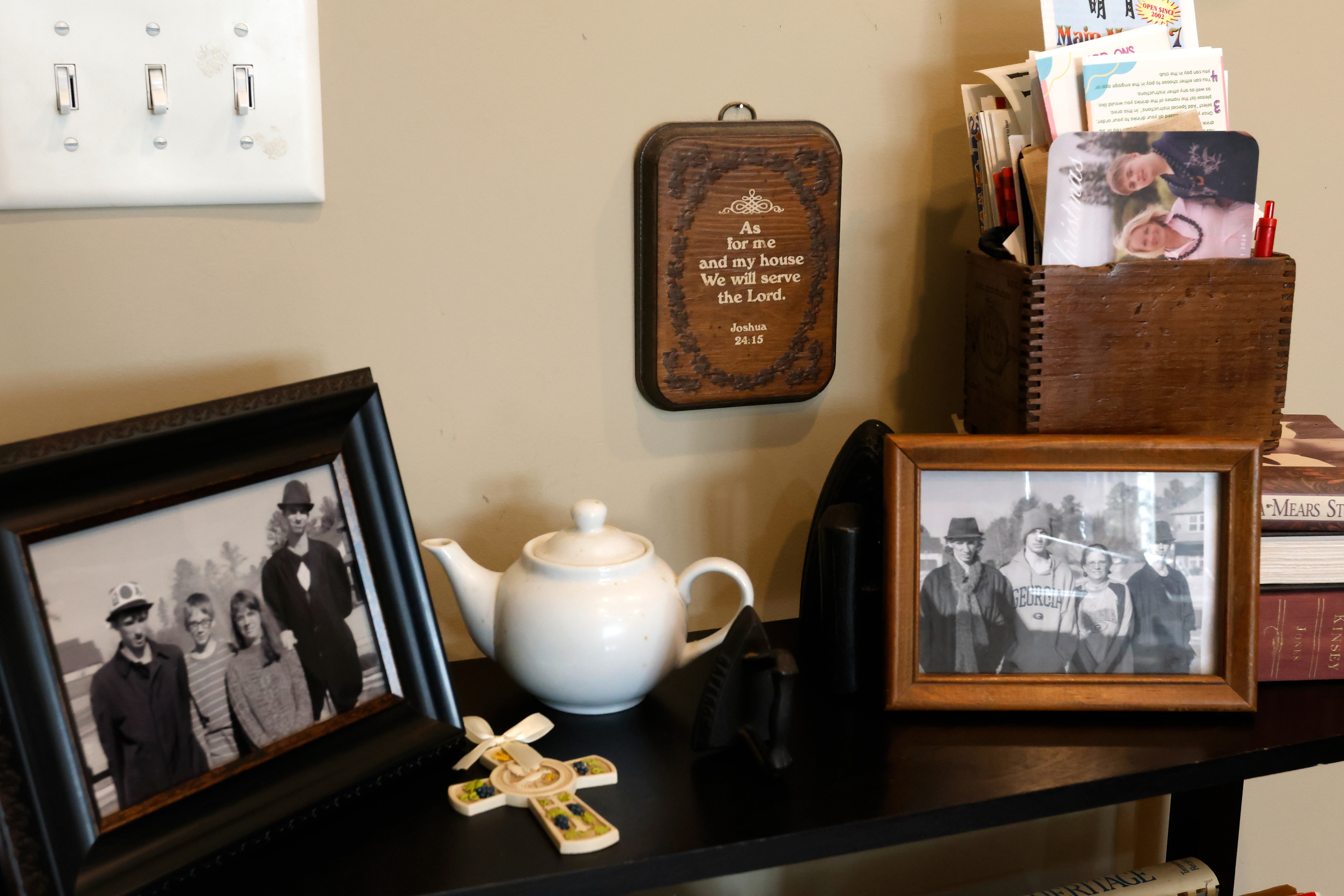 Family photos, religious items and other decorations are found throughout Cindi Weatherly's home in Watkinsville, Georgia, on Sunday, February 9, 2025. Weatherly, along with her daughter and grandsons watch their church's service livestream from home every Sunday.