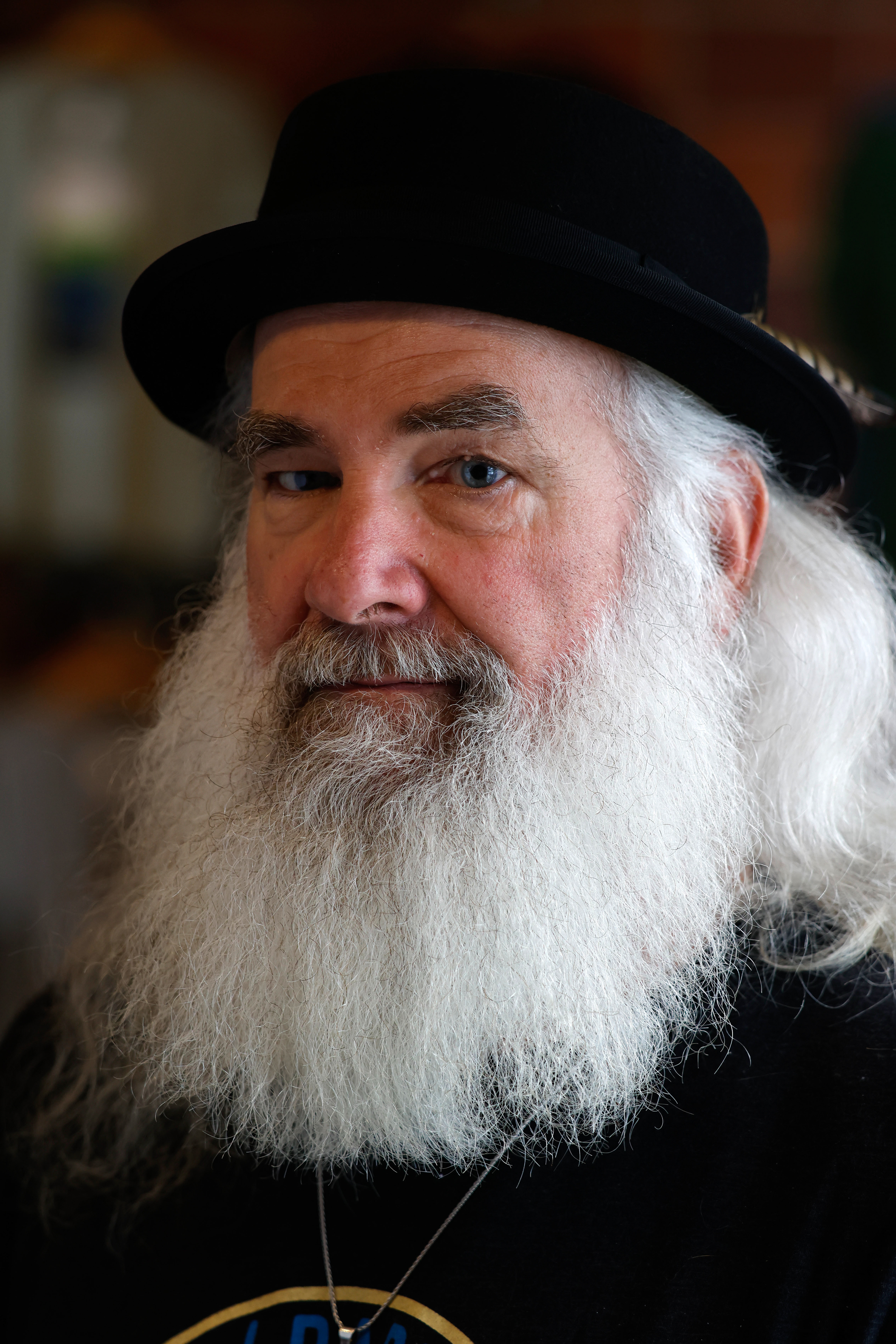 Bill Bennett poses for a portait in Outdoor 76 in Clayton, Georgia, on Saturday, March 15, 2025. Bennett is the general manager of Outdoor 76's Clayton location and is the co-chairman of the Clayton/Rabun County Appalachian Trail Community Committee.