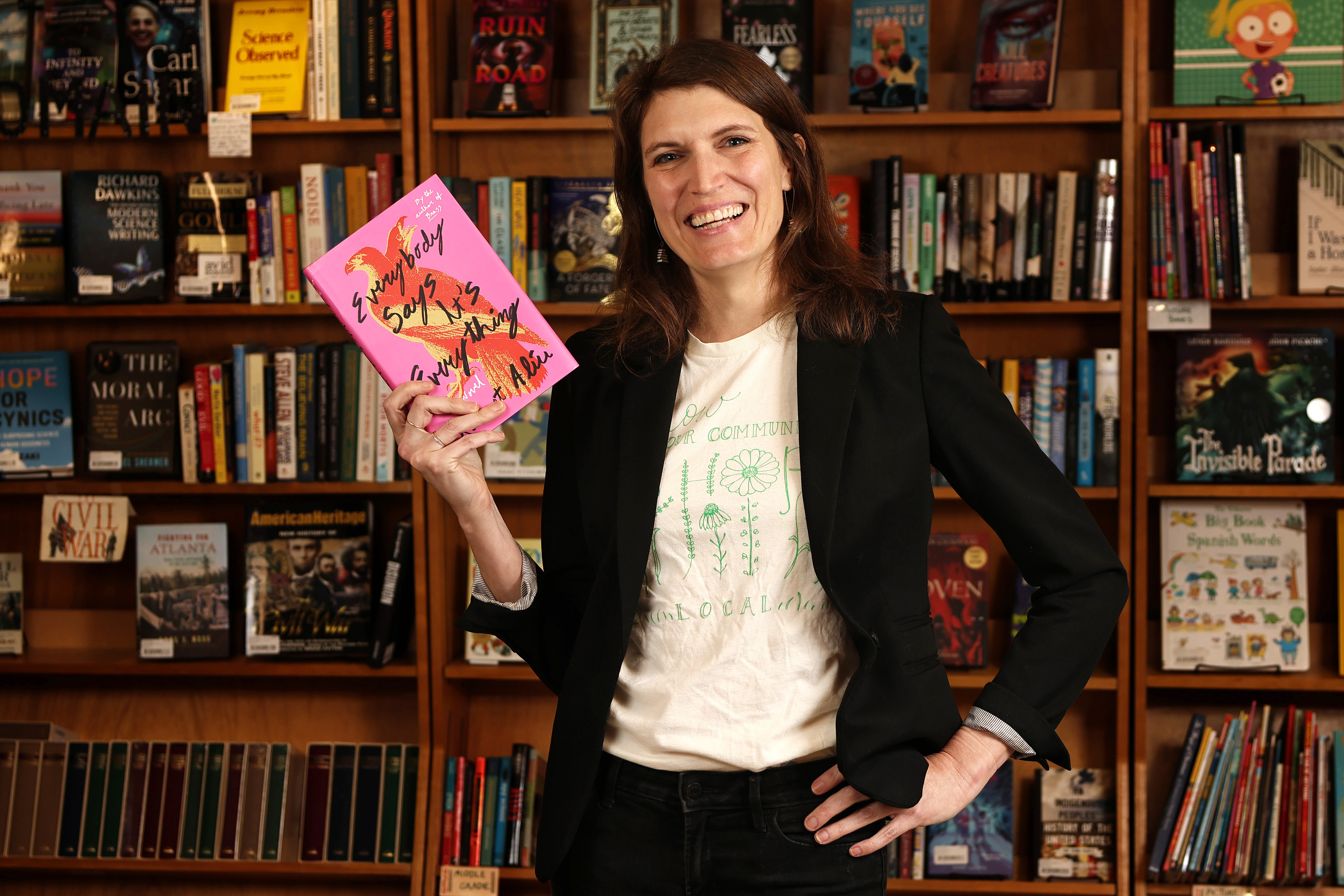 Janet Geddis, owner of Avid Bookshop, poses for a portait in her store on Tuesday, Oct. 28, 2025. Geddis earned her masters degree in gifted education and creativity theory from the University of Georgia before deciding to open a bookstore.