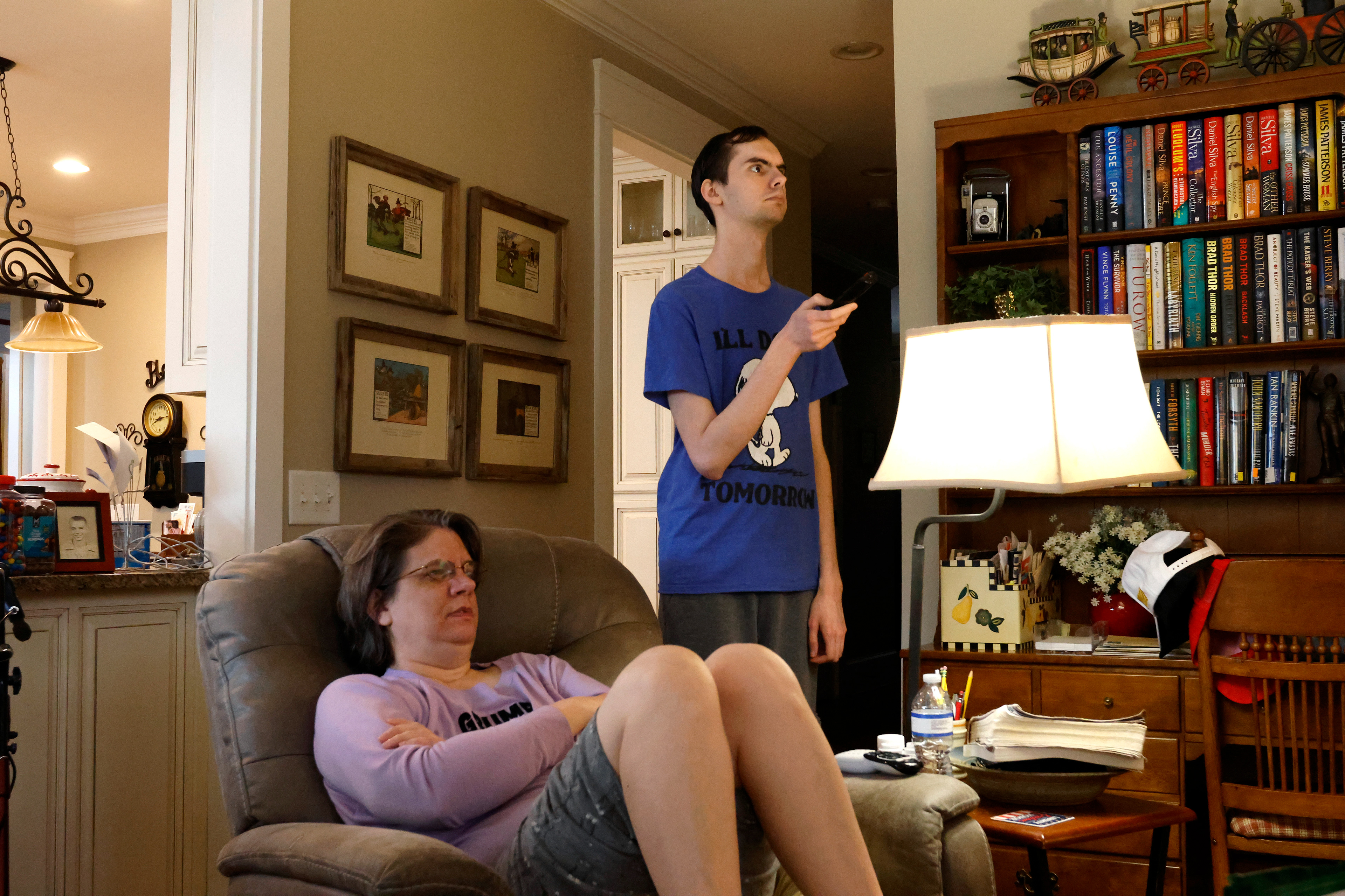 Nick Ballentine helps his mother turn on Beech Haven Church's livestream in their home in Watkinsville, Georgia, on Sunday, February 9, 2025. The Ballentines watch the service from home every Sunday. 