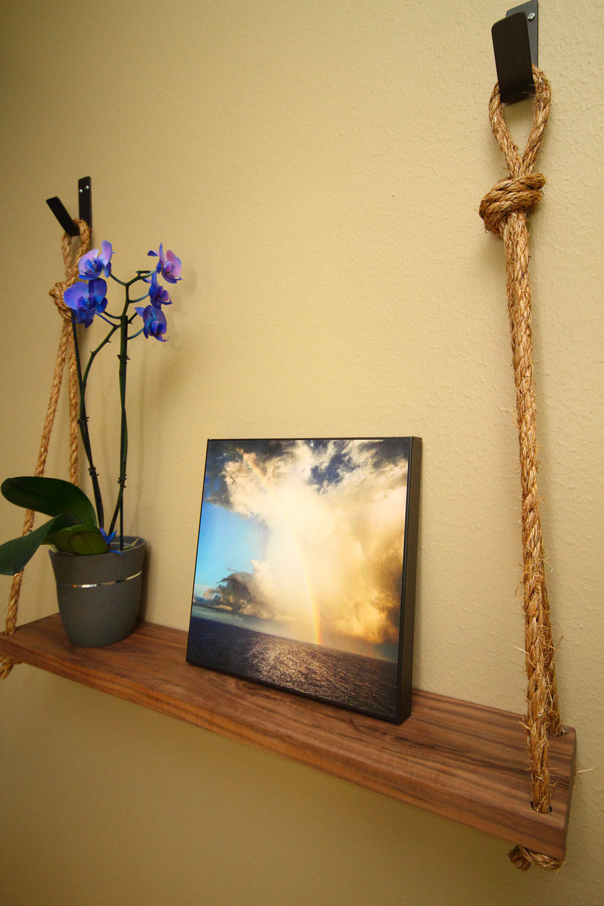Rope and walnut shelving with custom wall hooks