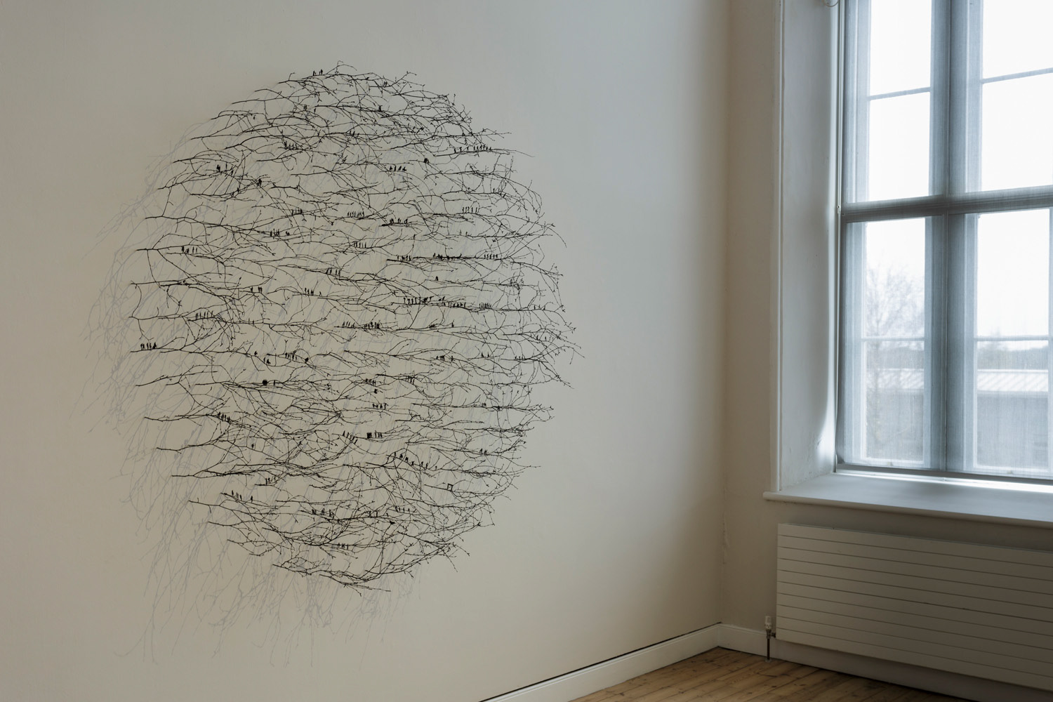 Prolonged by a Hundred Shadows (2019), twigs, paper, paint, twine, 240cm diameter